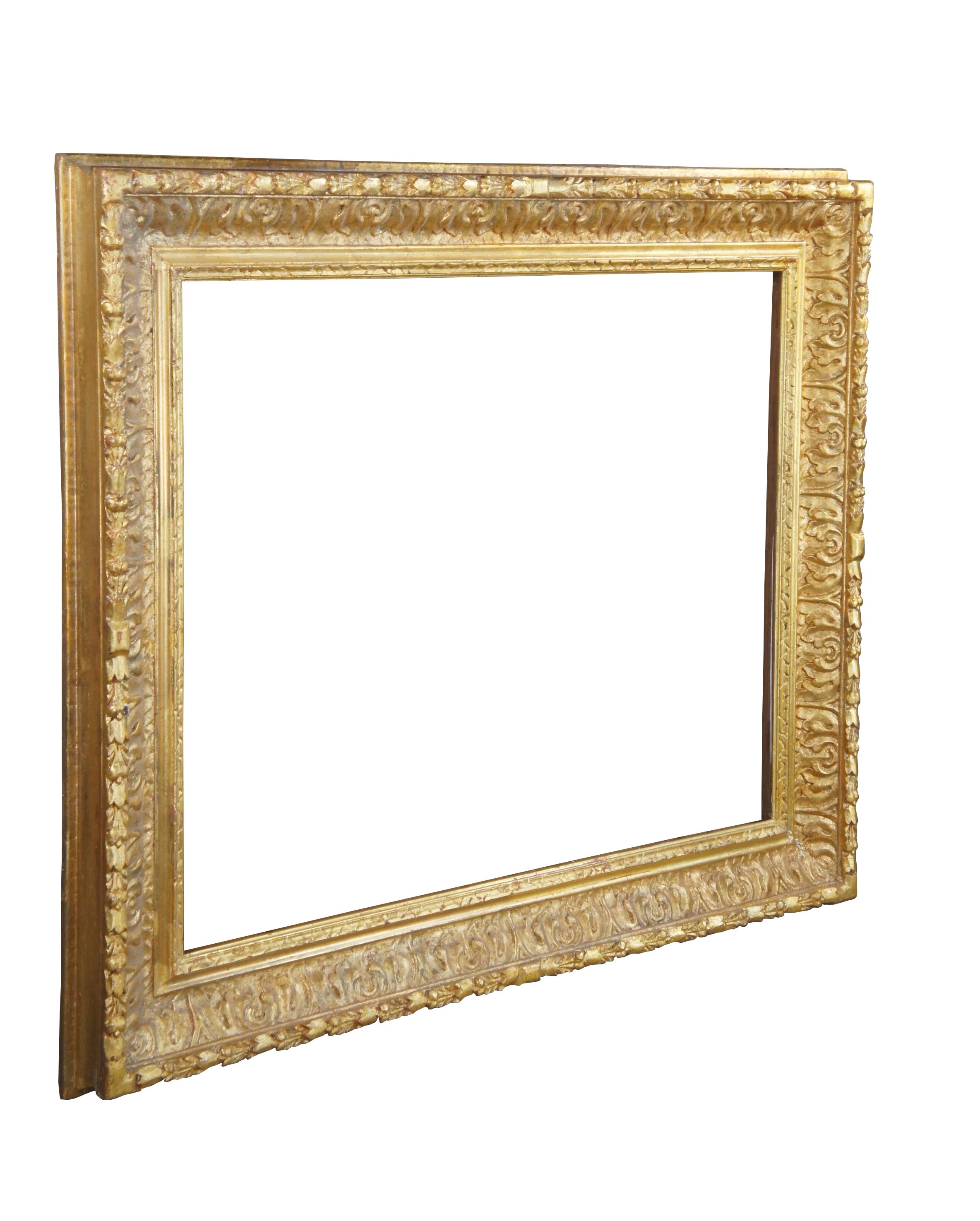 A very large and impressive antique giltwood picture / artwork / mirror frame featuring vibrant gold gilt acanthus design.  Accomodates artwork or mirror size 41