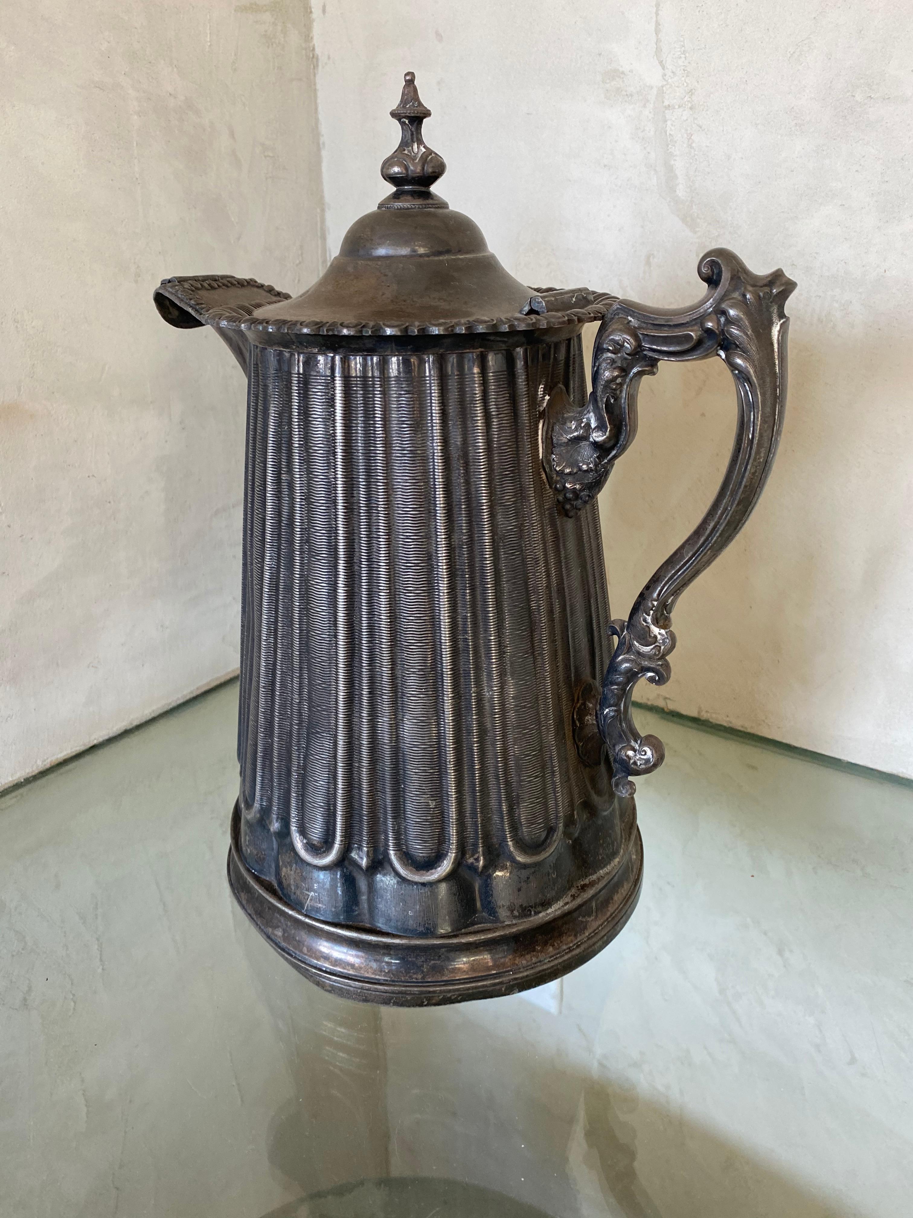 An exceptional, large antique Victorian walled pitcher for ice water has a bold circular rounded body. The jug makes a wonderful decorative piece. The upper rim is ornamented with an impressive egg and dart decorated border, incorporating a plain