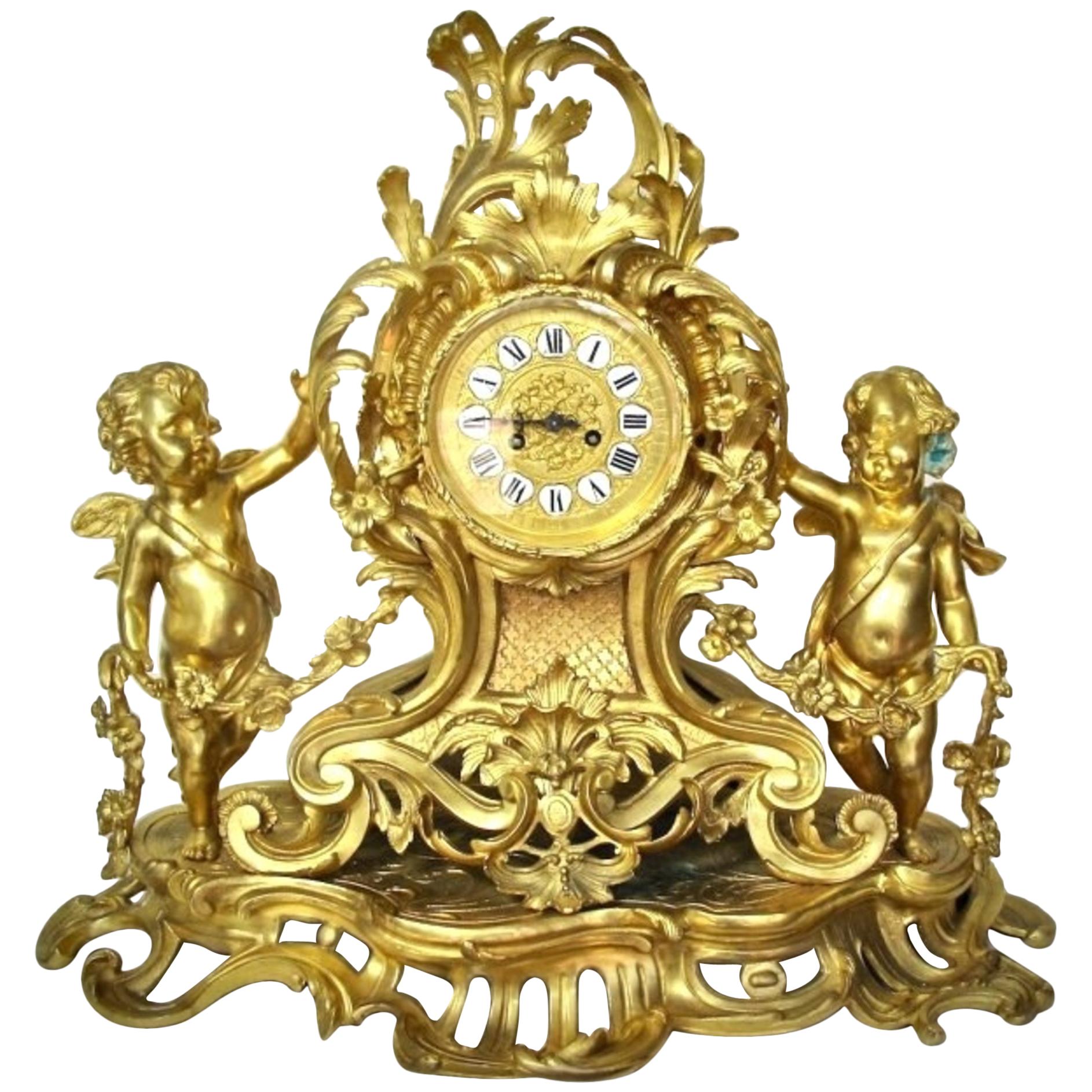 Grande et impressionnante pendule de cheminée Louis XV en bronze doré