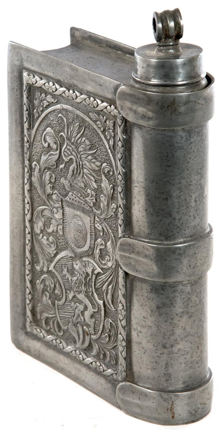 A continental Renaissance revival pewter flash elaborately incised with floral sprays and strapwork.