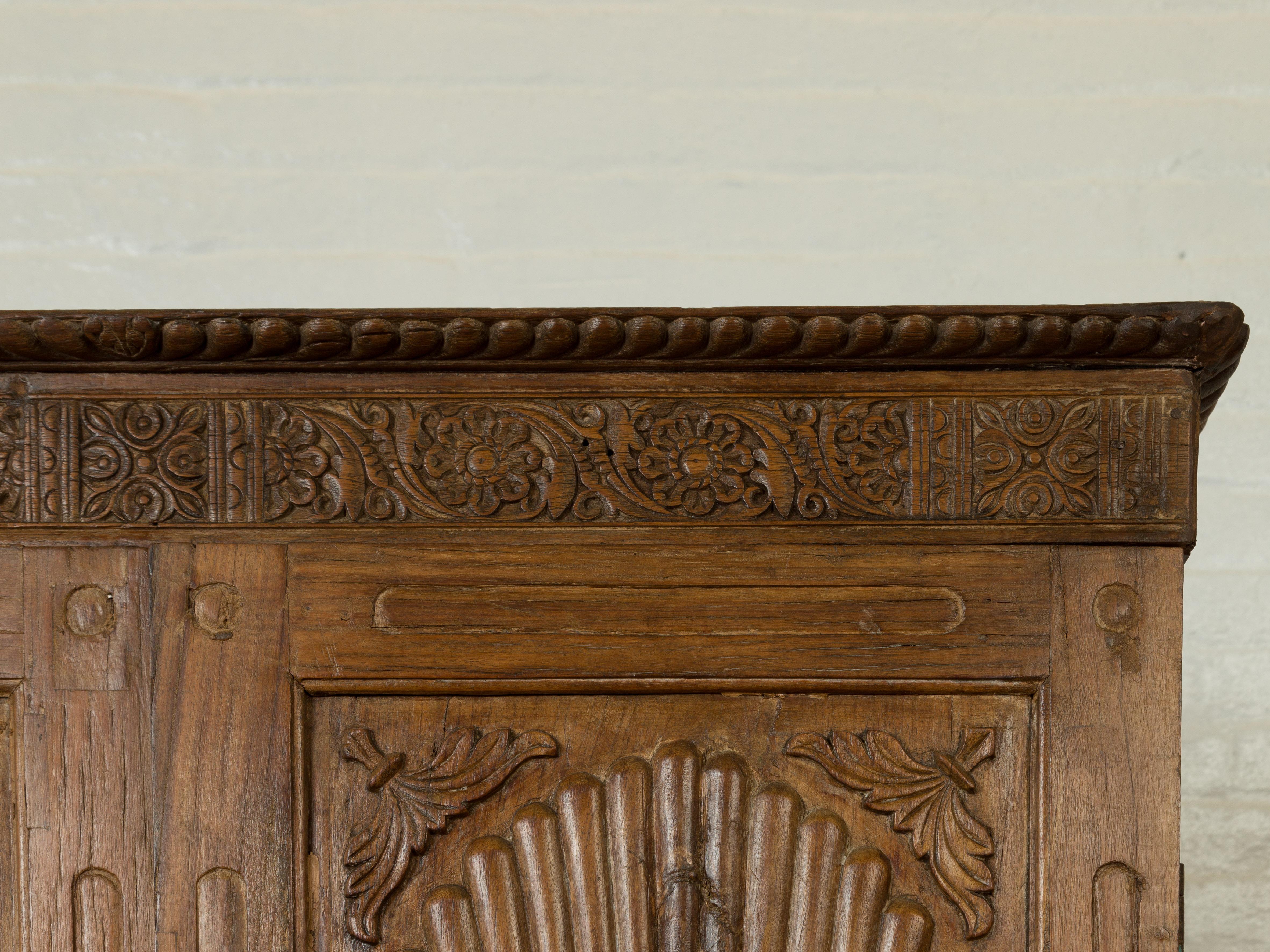 Large Indian Antique Wooden Cabinet with Carved Sunburst and Floral Motifs In Good Condition In Yonkers, NY