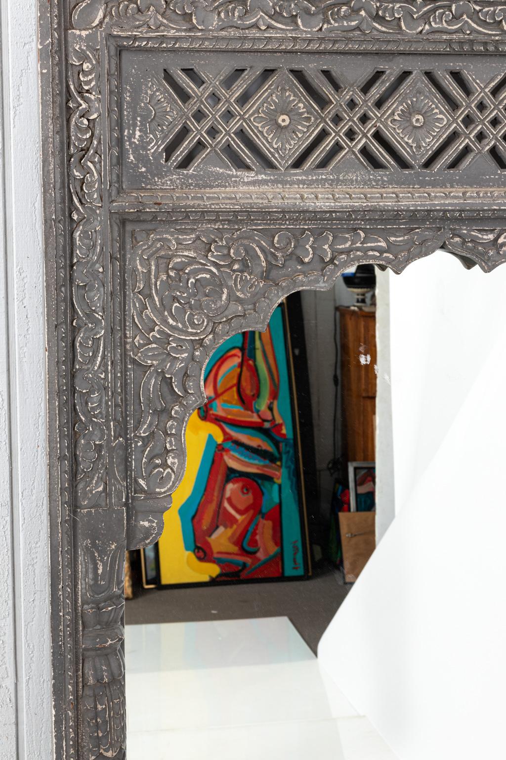 Large Indian fragment mirror with detailed tracery.