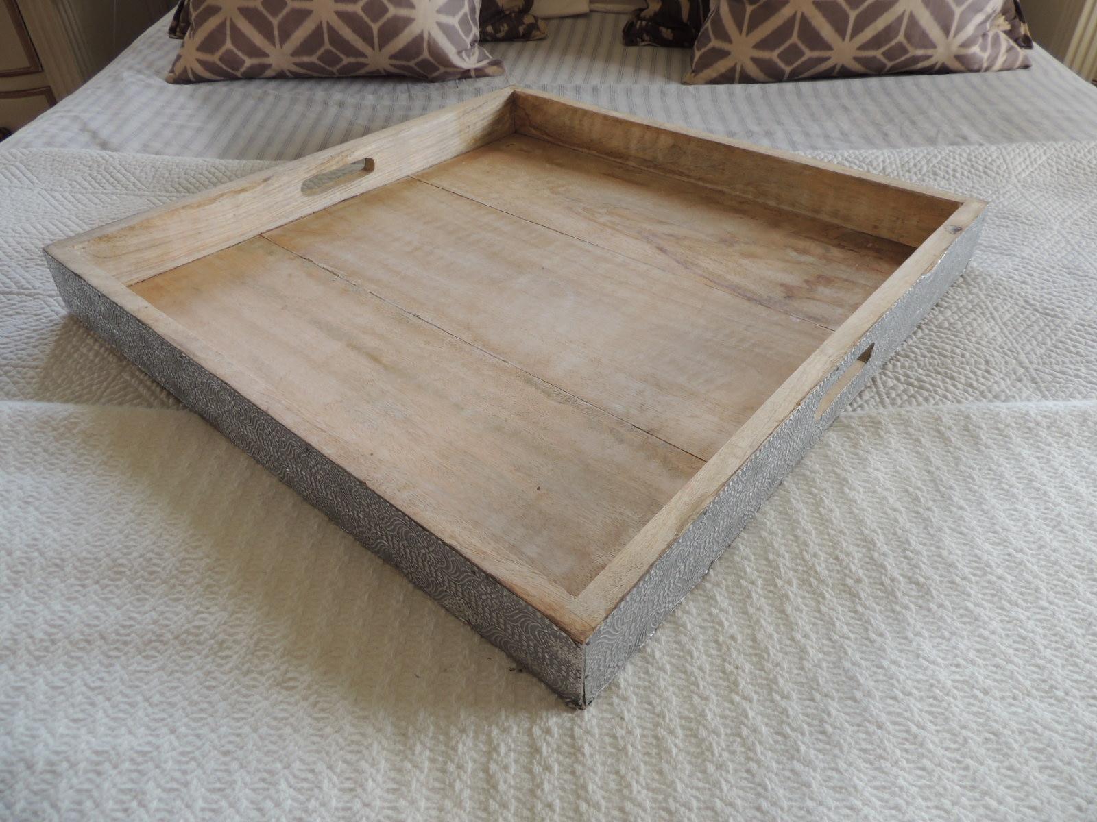 Large Indian reclaimed wood square tray with silver tin trim.
Reppossee style hammered trim.
Size: 22