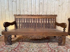 Large Indonesian walnut garden bench, carved