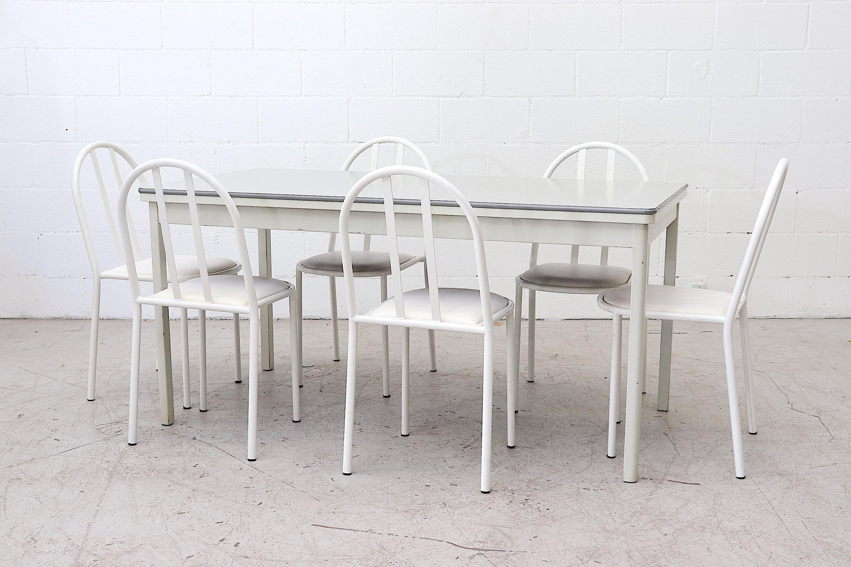 Large midcentury Ahrend De Cirkel industrial table with laminate top. Durable light grey laminate top on grey enameled metal frame with square tubular metal legs. In original condition with wear consistent with its use and age. Shot with white metal