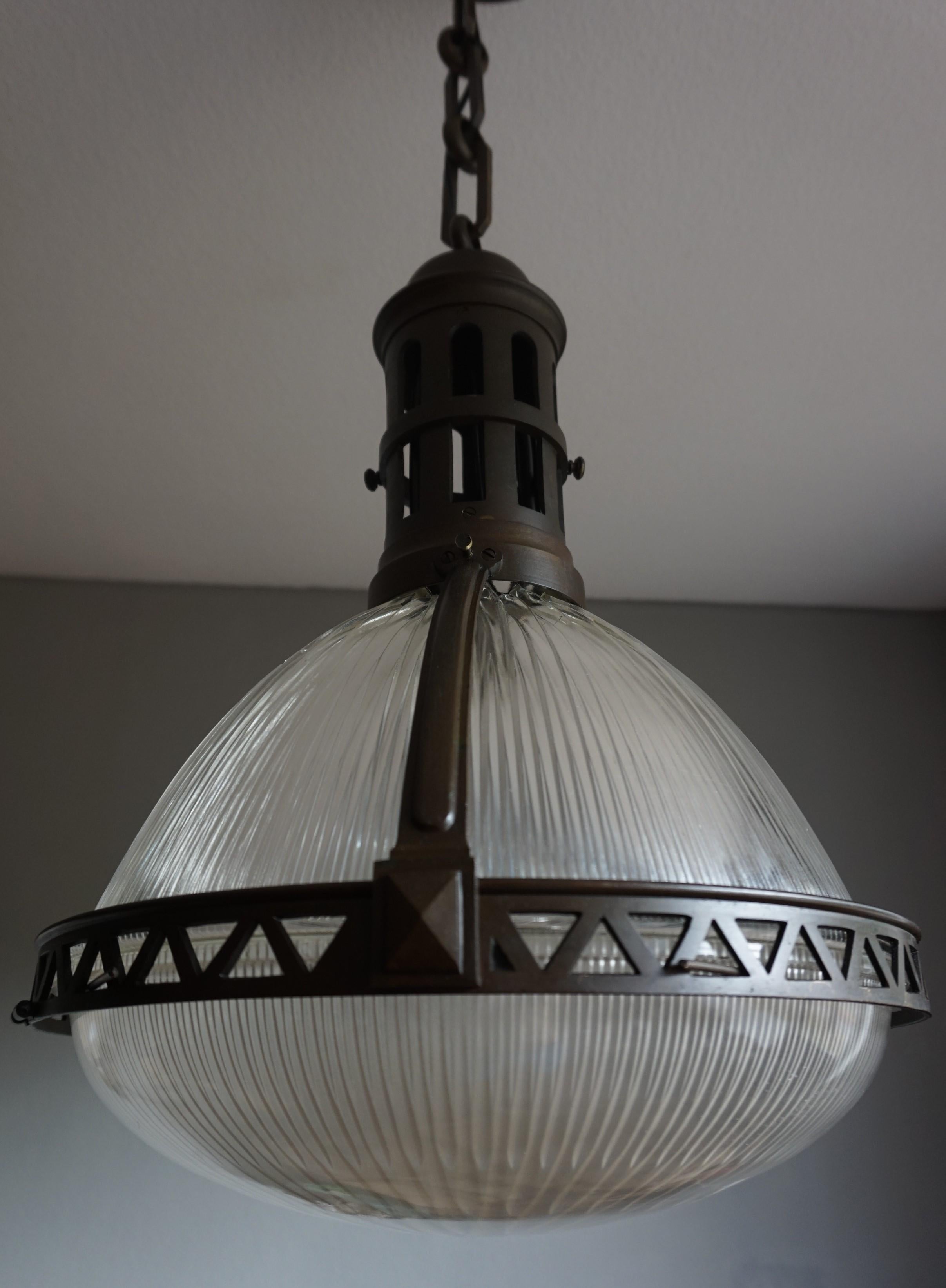 Antique Holophane light fixture, made in France.

You are looking at a beautiful, very rare and top quality Holophane pendant and chances are that you have never seen this type or size before. However, if you are looking for a completely original