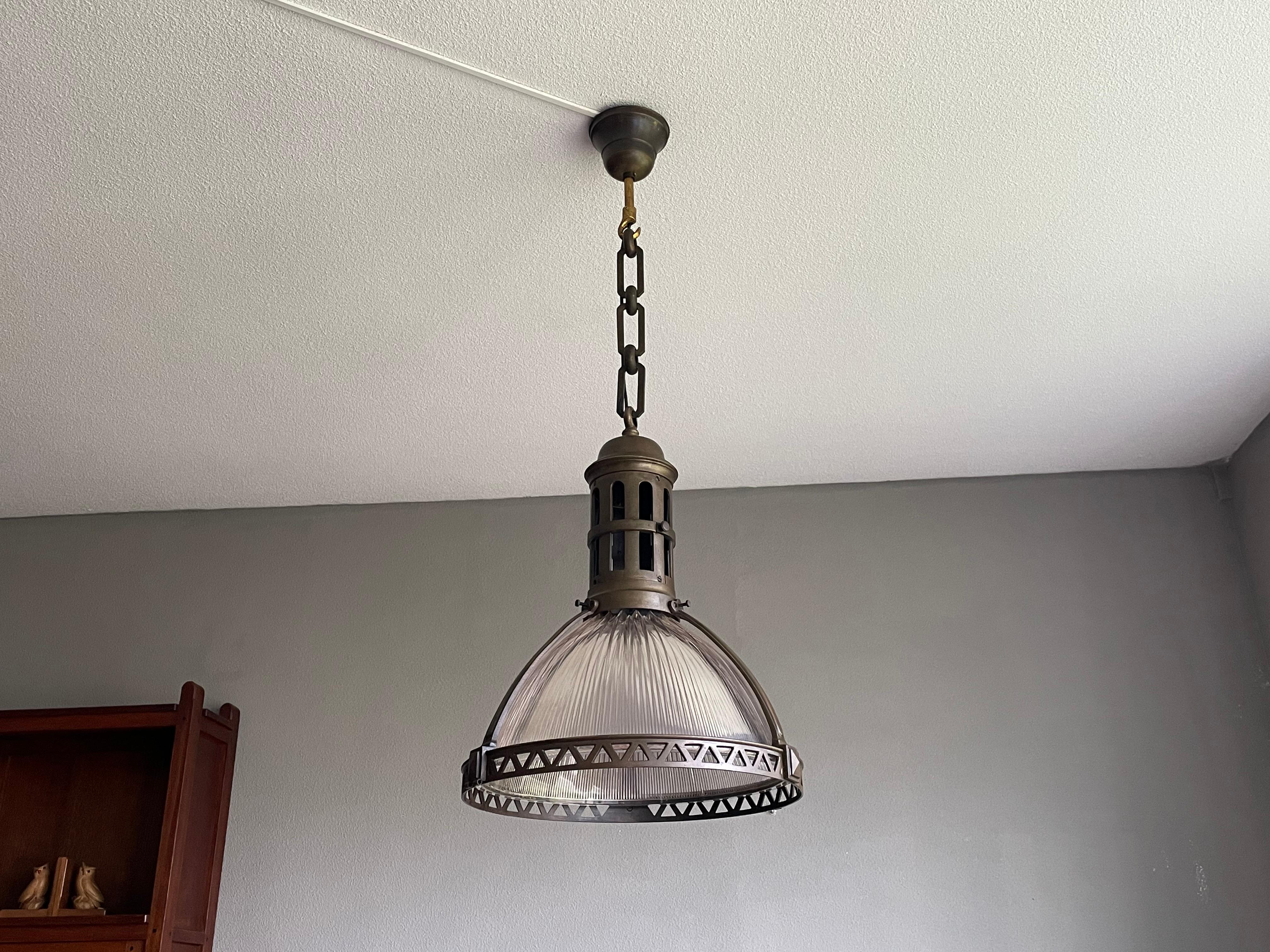 Large Industrial Arts & Crafts Bronze and Prismatic Glass Holophane Pendant In Good Condition In Lisse, NL