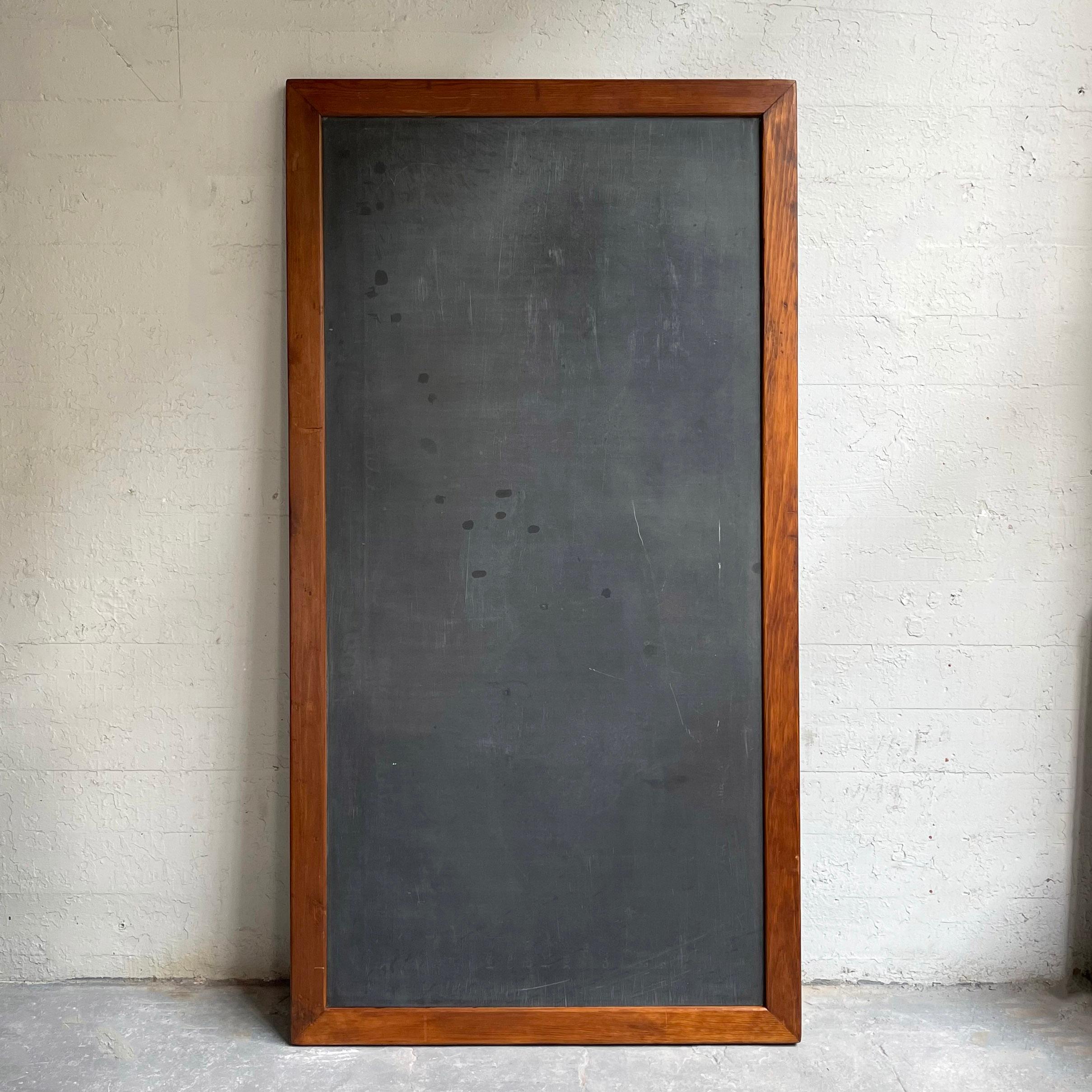 Impressively large, industrial, midcentury, schoolhouse, slate, chalkboard with a pine frame can be used vertically or horizontally and looks great leaning.