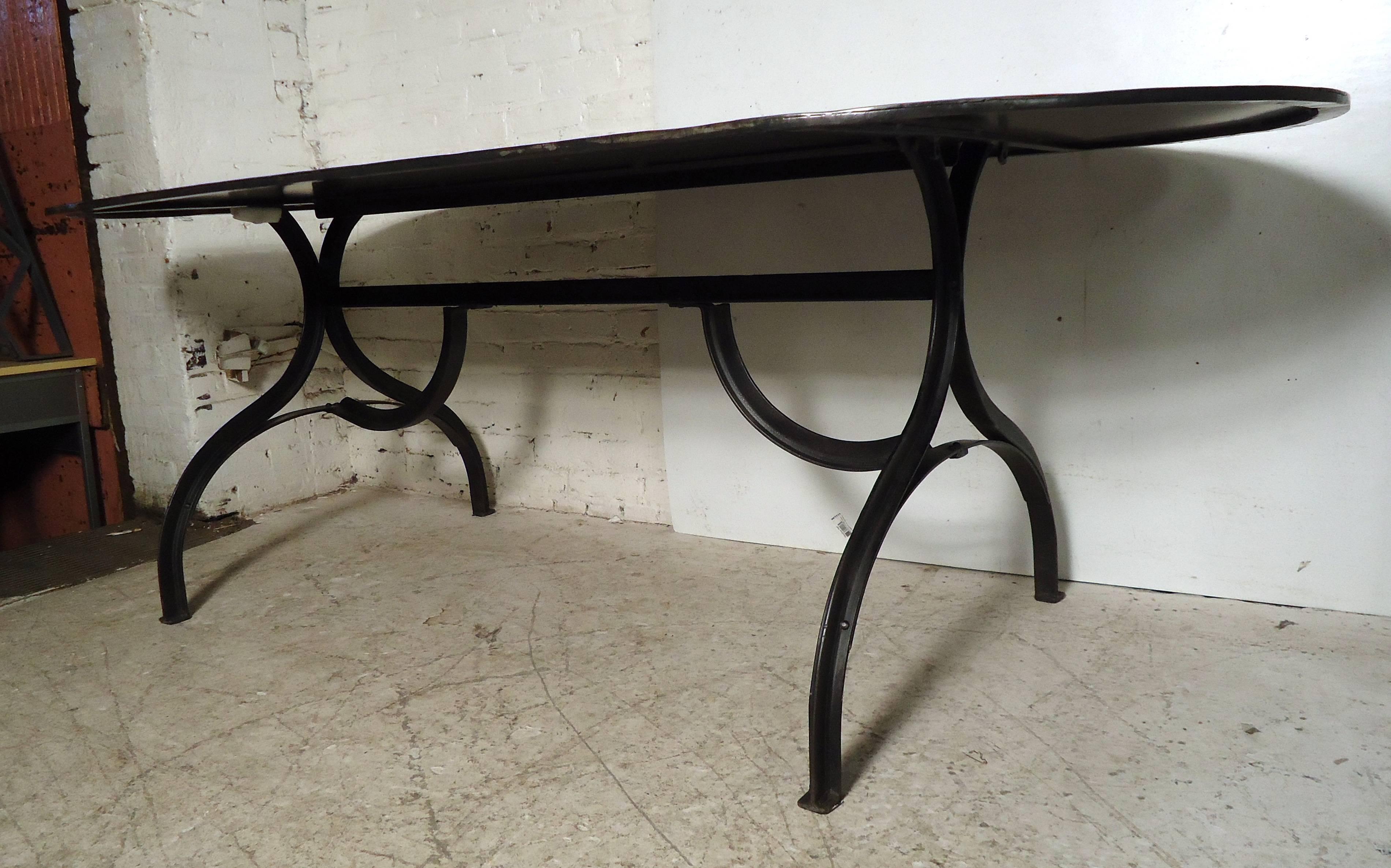 Stunning vintage style black dining table features a cast iron base, large oval metal tabletop.

Please confirm item location (NY or NJ) with dealer.
  