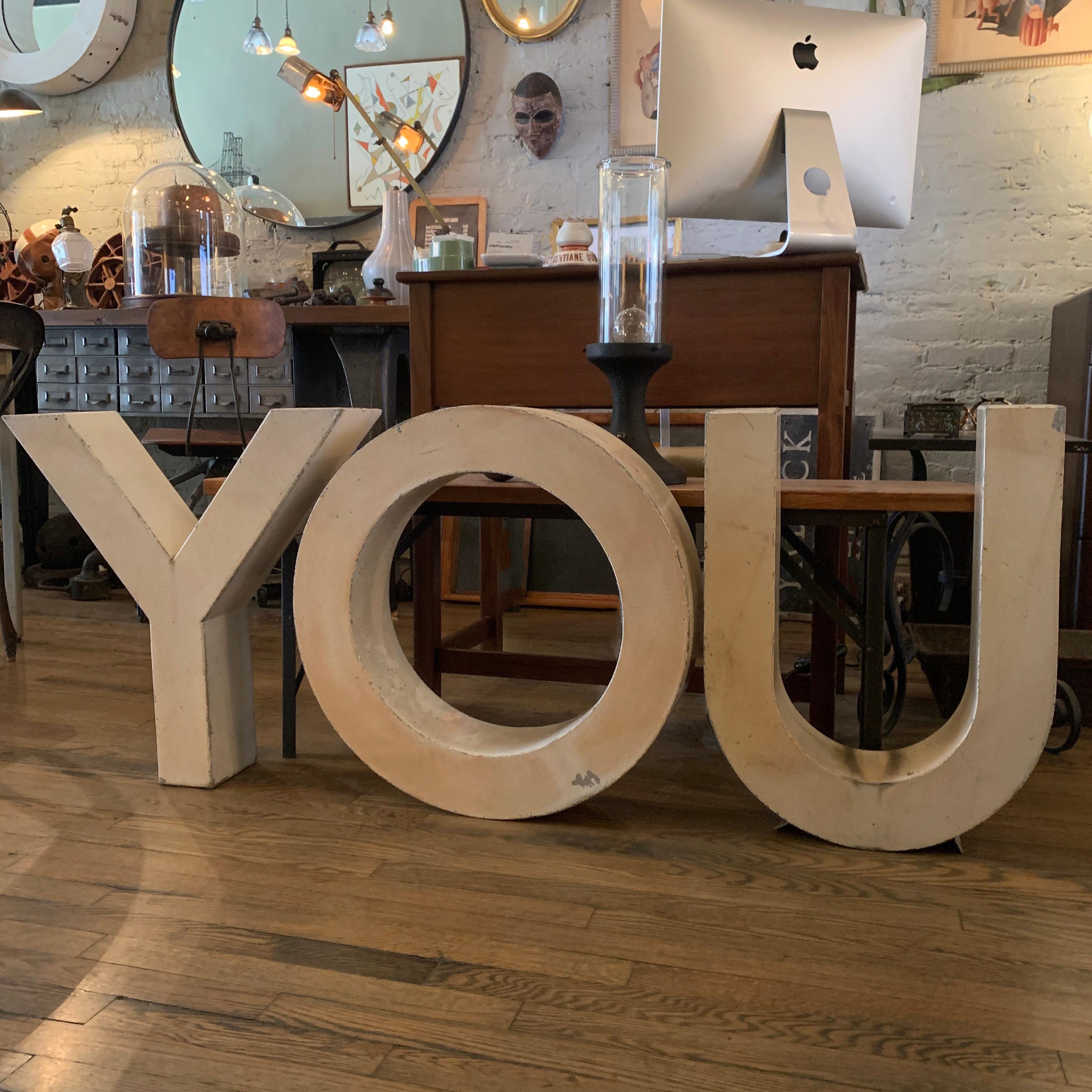 Set of 3, Large, industrial, painted metal, building signage, marquee letters YOU. The width of the letters Y and O is 24 inches and the letter U is 18 inches. Sold together as the word YOU.