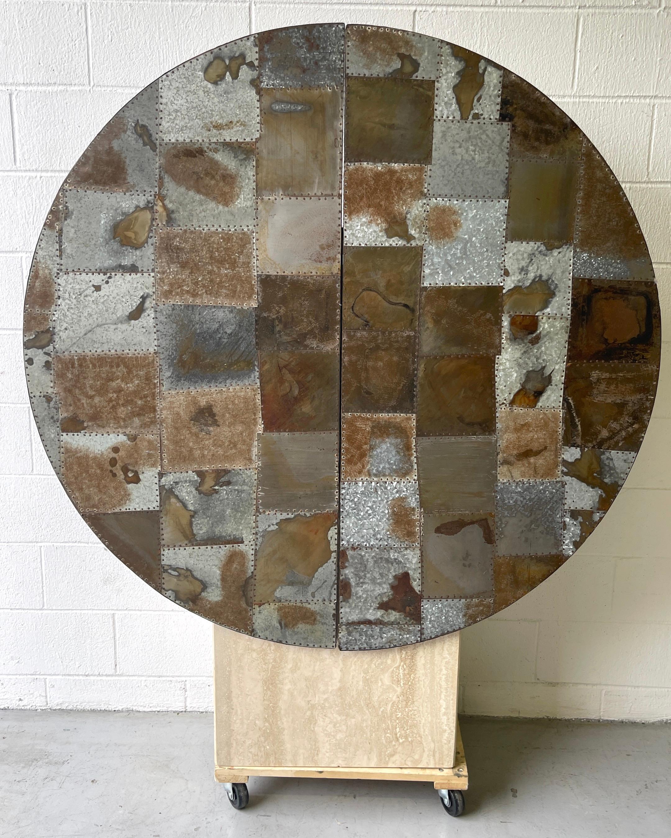 Large Industrial Patinated Patchwork Metal Hanging Disc Ba20th 
20th Century 

A stunning large scale patinated metal patchwork mosaic with nail head trim, two door hanging disc bar, with blackened /ebonized case fitted with two adjustable