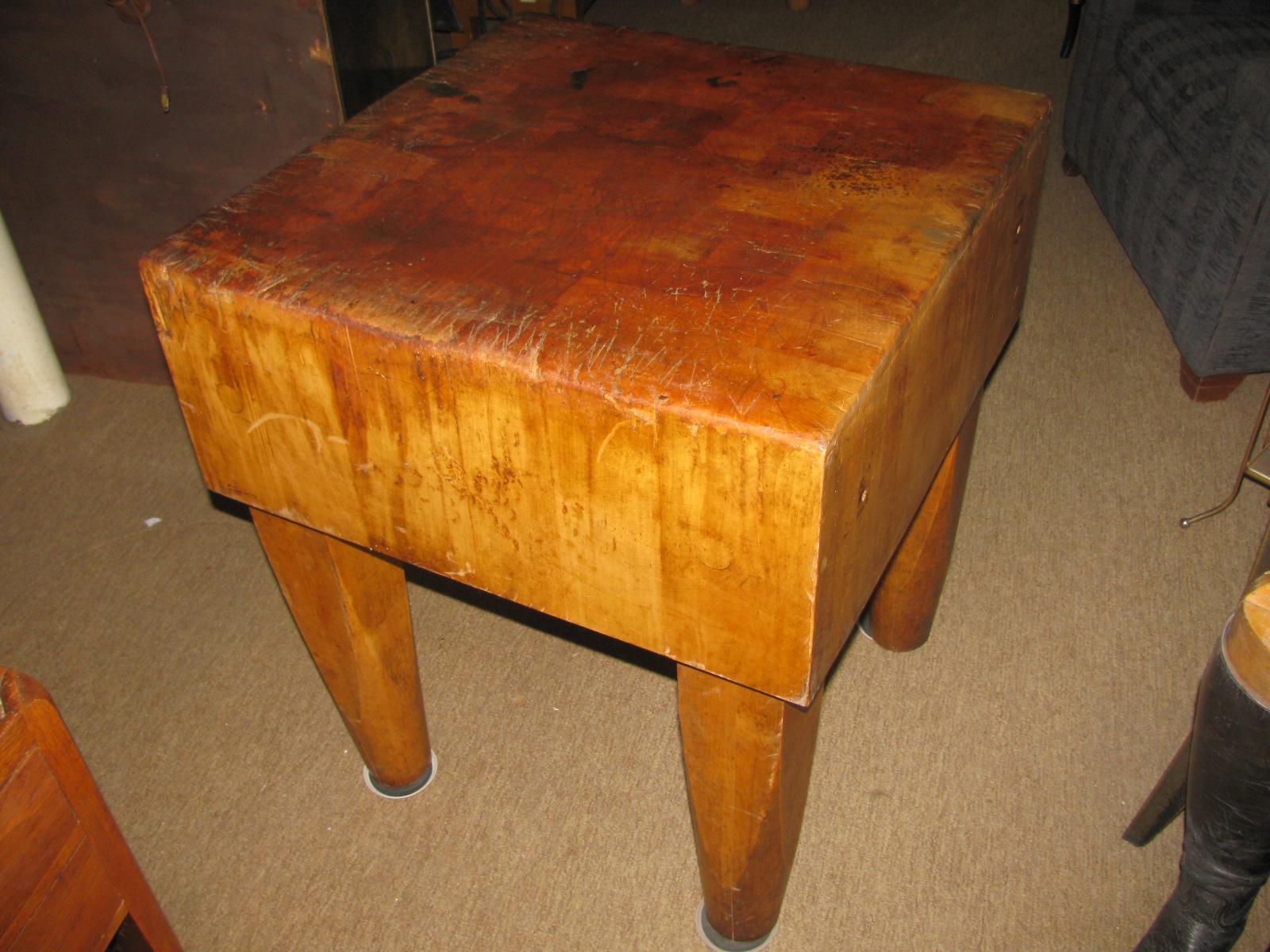 Large maple block with thick heavy legs for support. Has the appropriate wear from years of use.
Very heavy yet very sturdy. Wheels have been added with locks and they work fantastic. Top has been lightly sanded and bleached. Linseed oil applied.