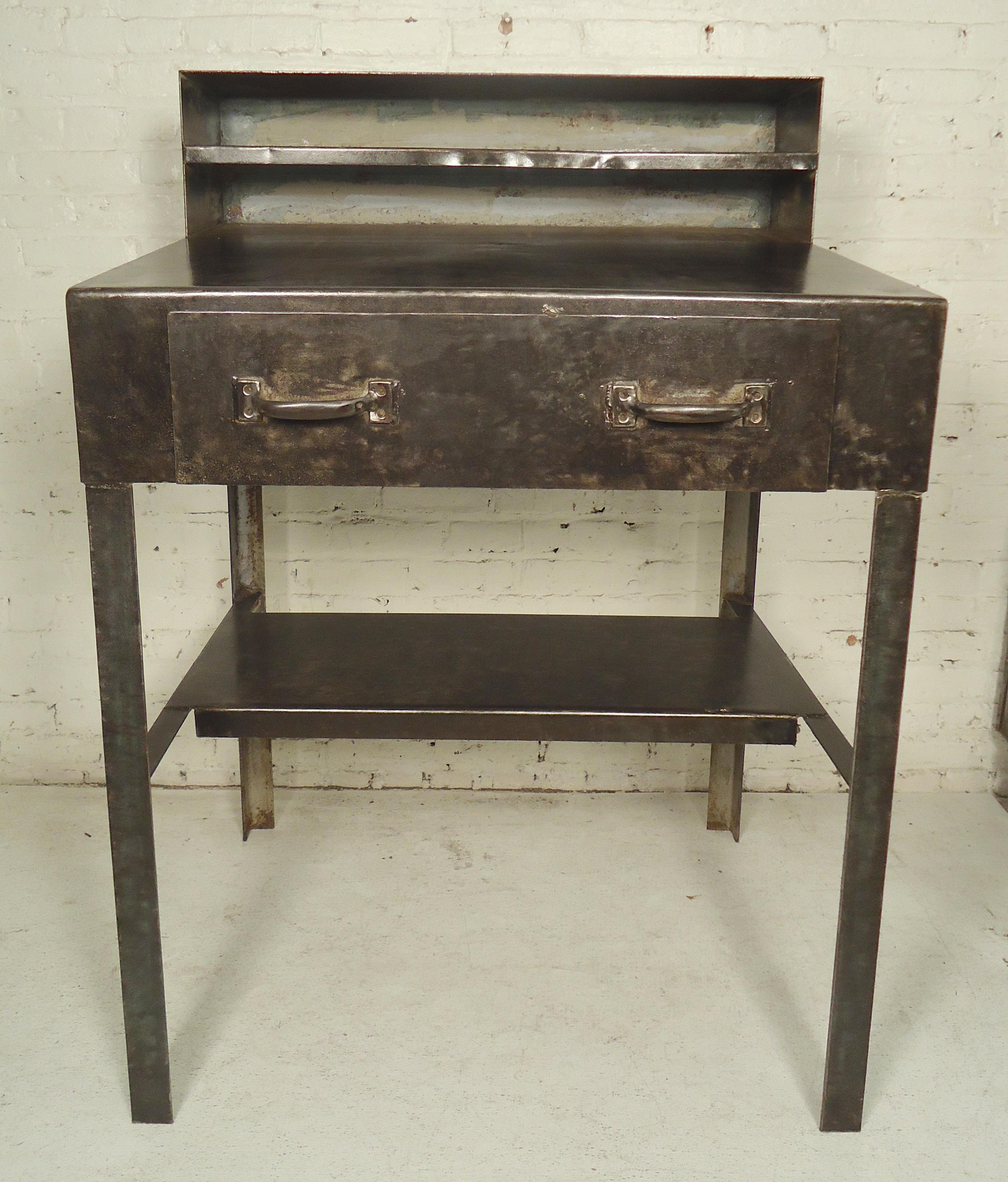 Heavy duty metal desk with slanting top, perfect for bar or restaurant use. Restored in a bare metal style finish.

(Please confirm item location - NY or NJ - with dealer)
    