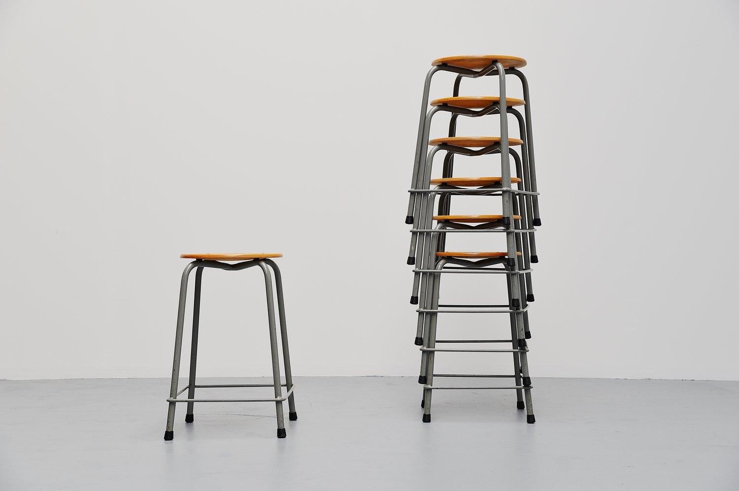 Very nice and large set of stools made by Ahrend de Cirkel, Holland, 1970. These stools have a very nice industrial grey lacquered tubular metal frame and a round birch plywood seat. The stools are stackable and we have a large set of 92 pieces
