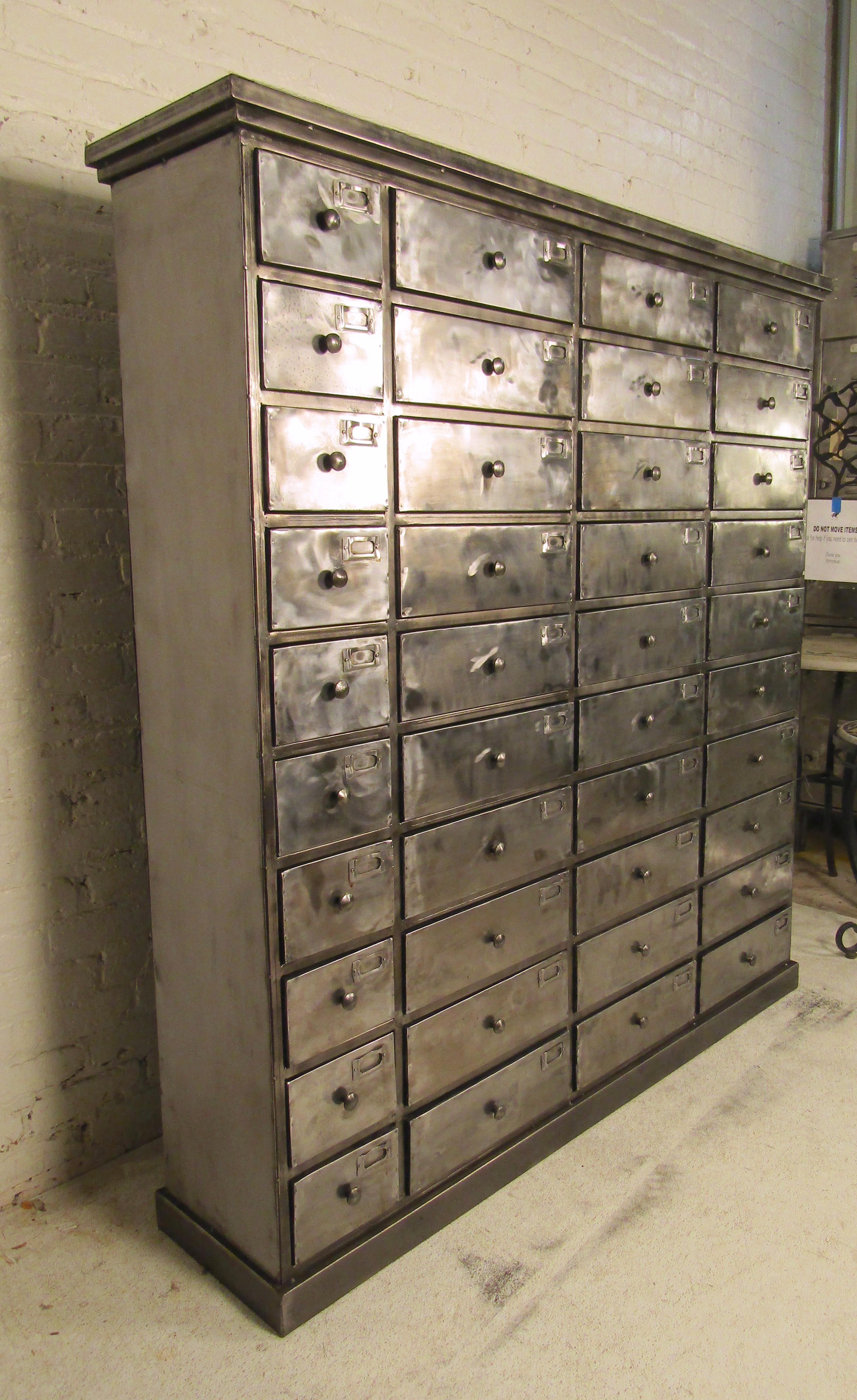 Massive metal file cabinet restored in a bare metal style finish.
(Please confirm item location - NY or NJ - with dealer).
  