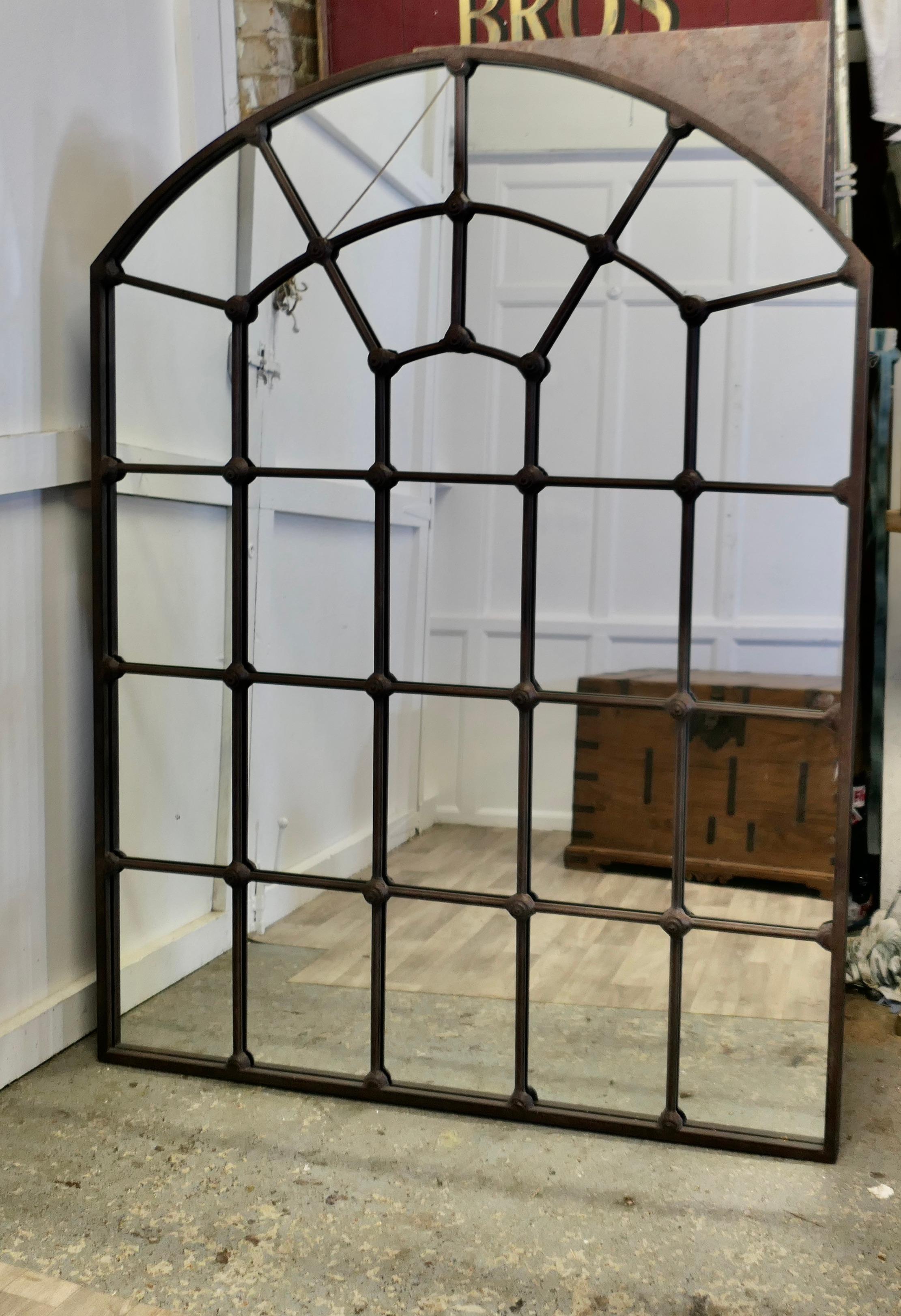 Large Industrial Style Arch Top Window Mirror 

This is a large and very attractive stand alone, the Iron Window Frame Mirror is divided into many pains with an arched top 
A truly stunning piece made in Iron which has a brown coating making it look