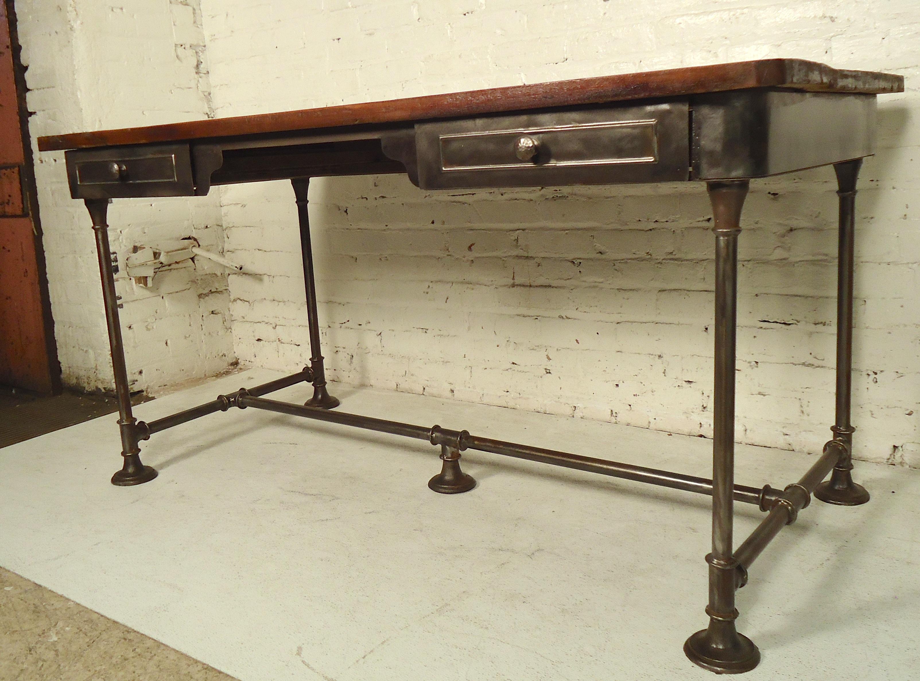 Heavy metal desk with thick repurposed wood top. The desk has been given a bare metal style finish and the top has been hand lacquered.

(Please confirm item location - NY or NJ - with dealer).
 