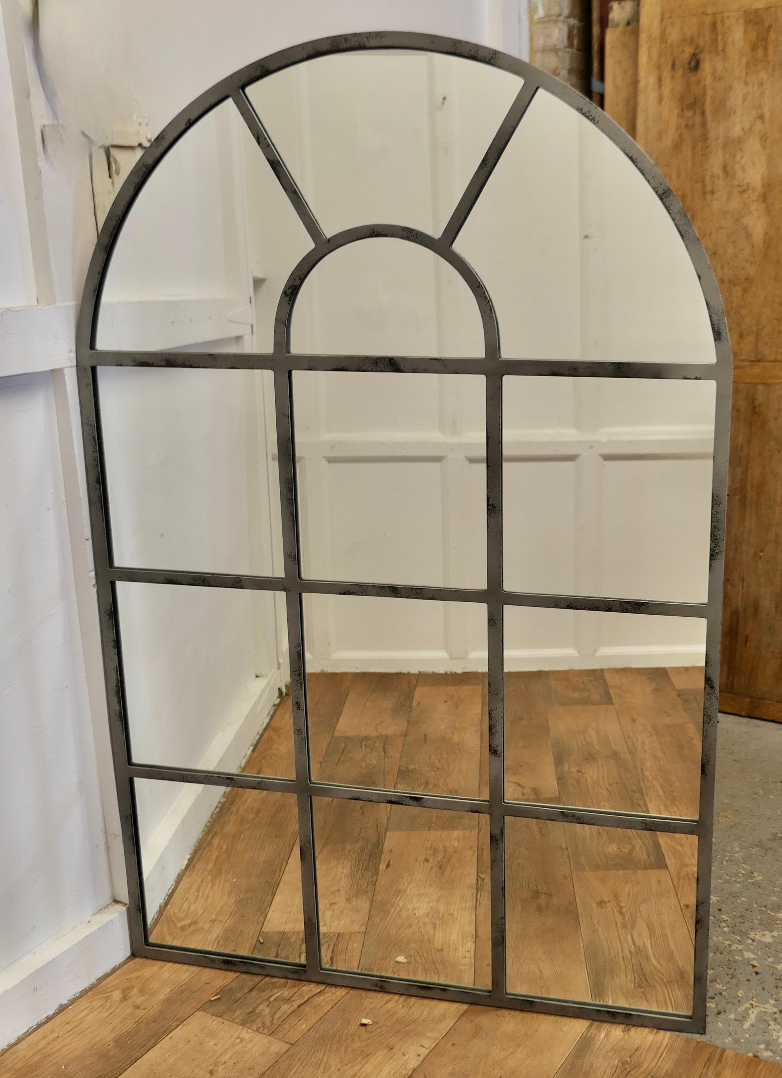 Large Industrial Style French Window Mirror 

This is a large and very attractive stand alone, the Iron Window Frame Mirror is divided into many pains and it has an arched top 
A truly stunning piece made in Iron which has a grey coating 
The Mirror