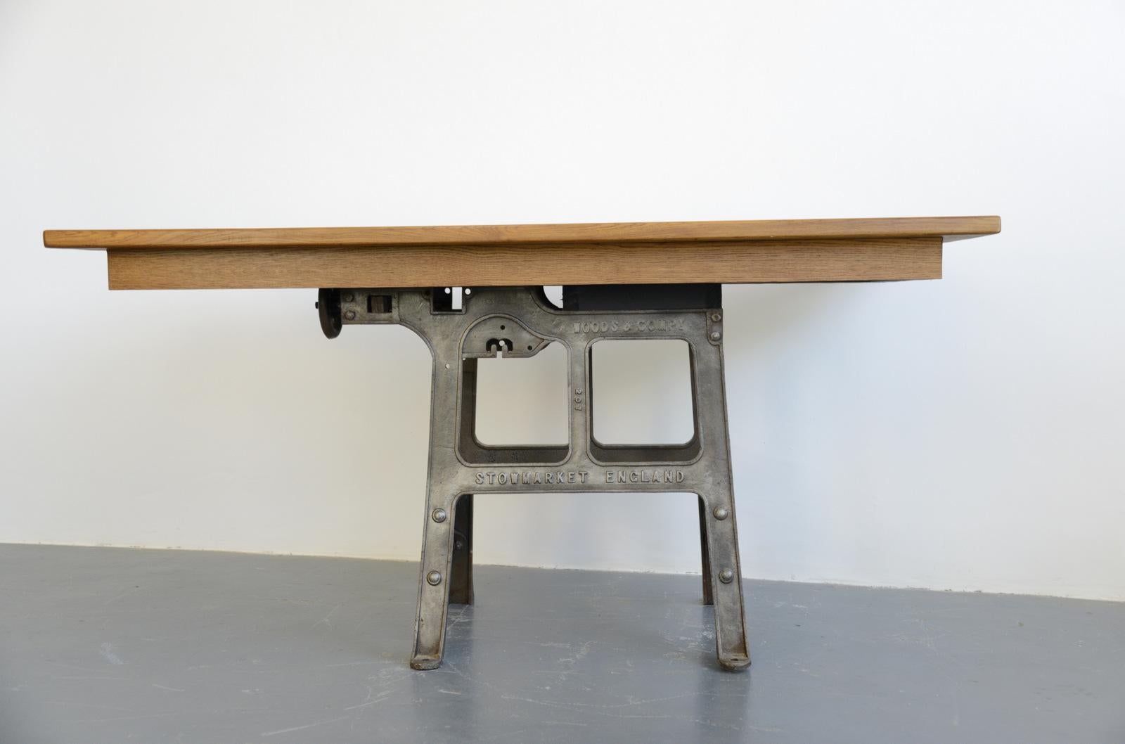 Large industrial table by Woods & Co., circa 1910

- Cast iron base
- Solid oak top
- English, 1910
- Measures: 98 cm tall x 90 cm deep x 200 cm long.