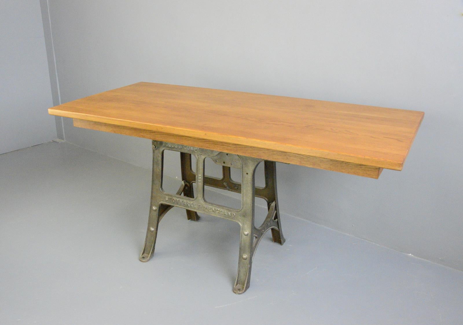 Large industrial table by Woods & Co Circa 1910.

- Cast iron base
- Solid oak top
- English ~ 1910
- Measures: 98cm tall x 90cm deep x 200cm long.

  