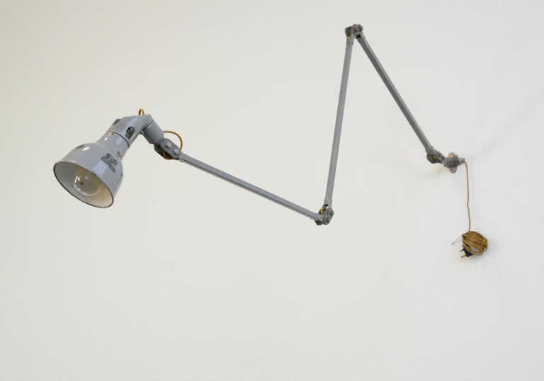 Large industrial task lamp by Mek Elek, circa 1950s

- Original grey paint
- Grey enamel shade
- On/Off switch on the bulb holder
- Takes B22 fitting bulbs
- Made by Mek Elek, London
- English ~ 1950s
- 14cm wide x 14cm tall 
- Extends up