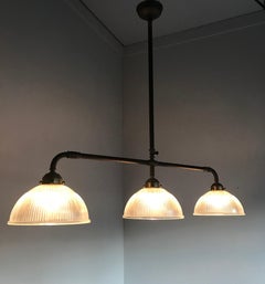 Large Industrial Three-Light Holophane Glass Style Chandelier with Brass Rods