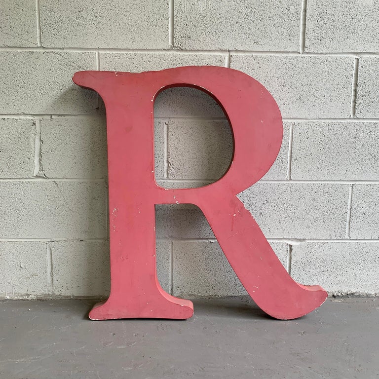 Large, industrial, painted aluminum, Times Roman font, marquee letter R. The letter can stand on it's own or be wall mounted.