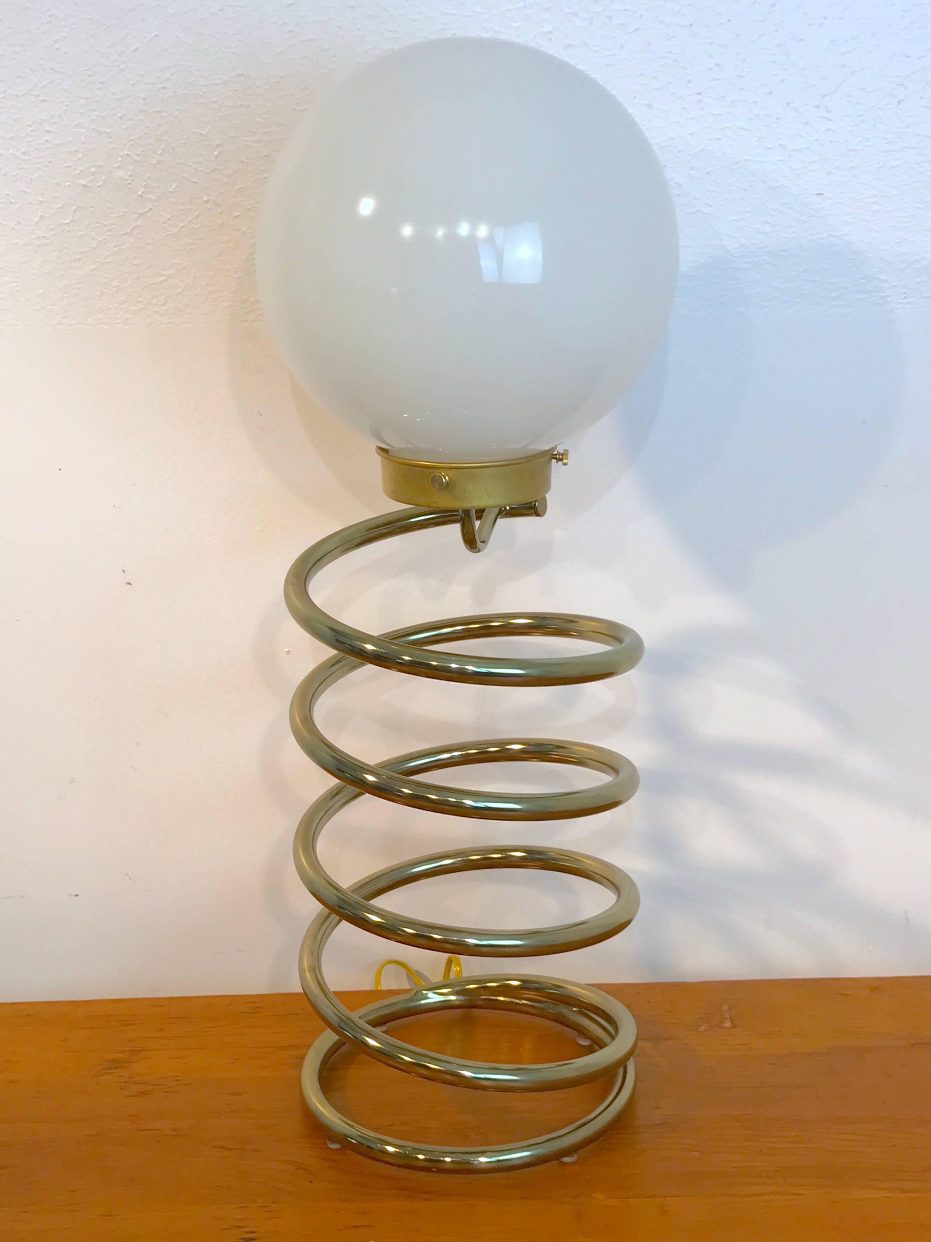 Large Ingo Maurer Spring Table Lamp, circa 1965
1960s, Europe
Dimensions: Height: 27 in Diameter: 9 in

Light up your home with the elegance of the past with this large Ingo Maurer Spring table lamp. Designed by the German lighting mastermind, Ingo