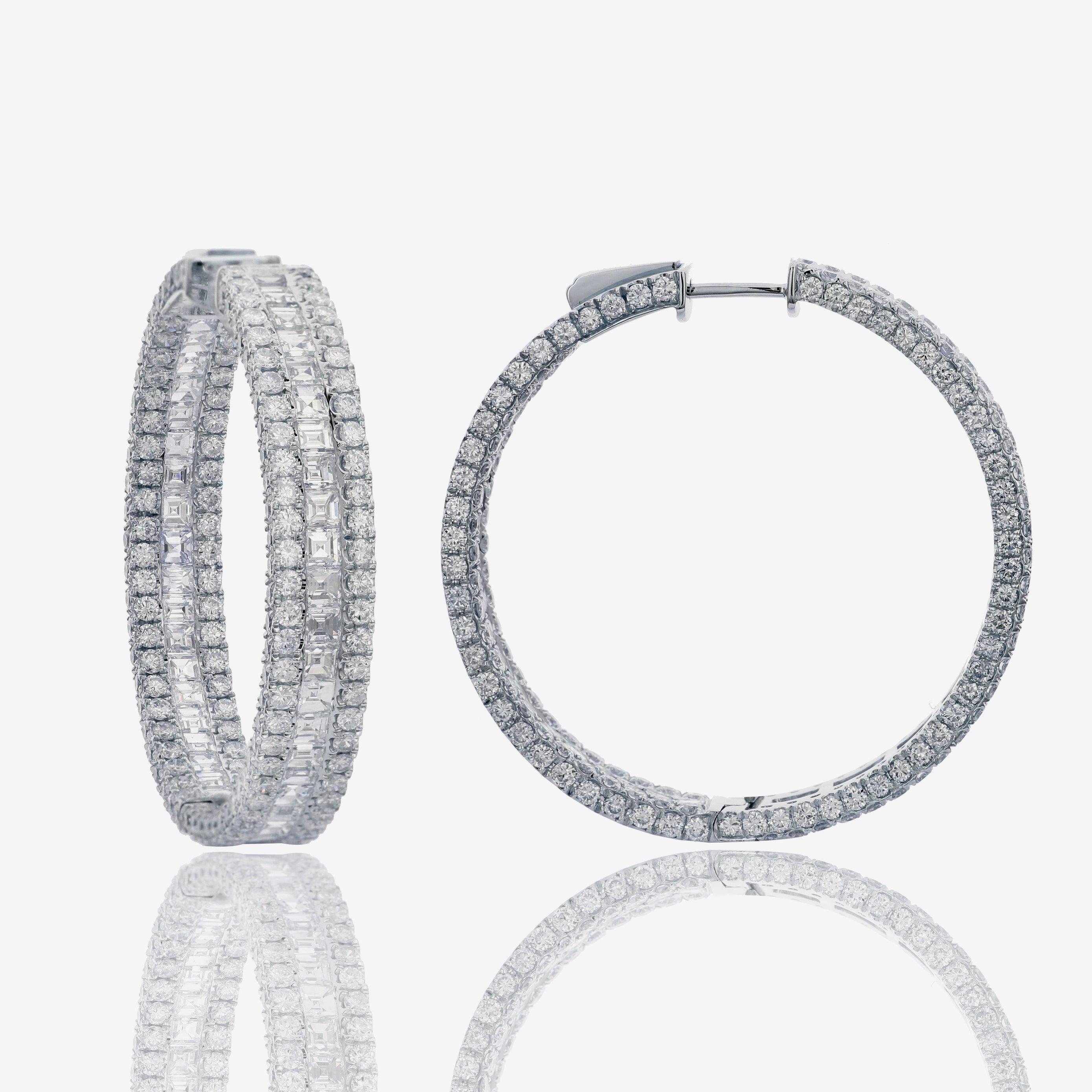 These stunning inside-out hoop earrings feature 13.34 carats of sparkling princess and round diamonds.  A total of 406 diamonds of VS-SI clarity and G-H color.  Set in 18k white gold. Fine craftsmanship, even better in person.


