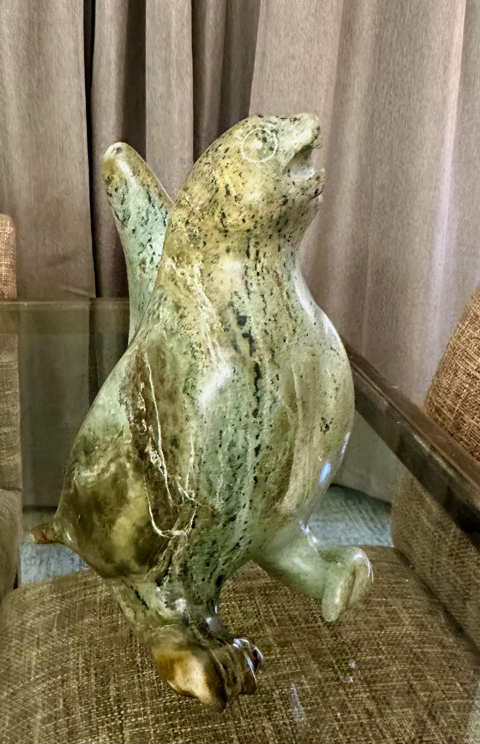 Large stone carving of a bird by the indigenous Inuit People who inhabit parts of Canada and Alaska. The sculpture is signed on bottom by unknown artist along with Canada Eskimo seal. Weighs over 13 pounds. 