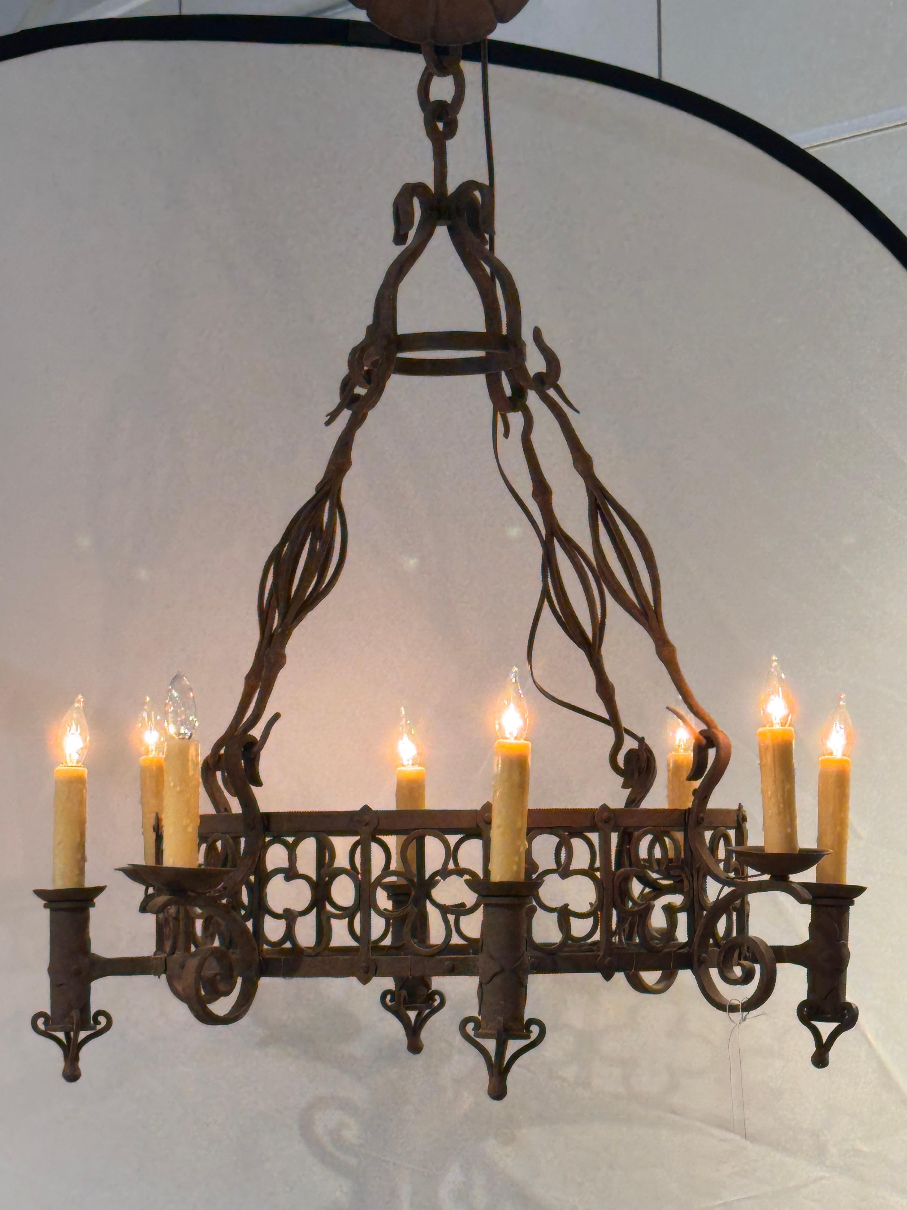 Large Iron Chandelier With Gothic-Inspired Scrollwork In Good Condition For Sale In Charlottesville, VA
