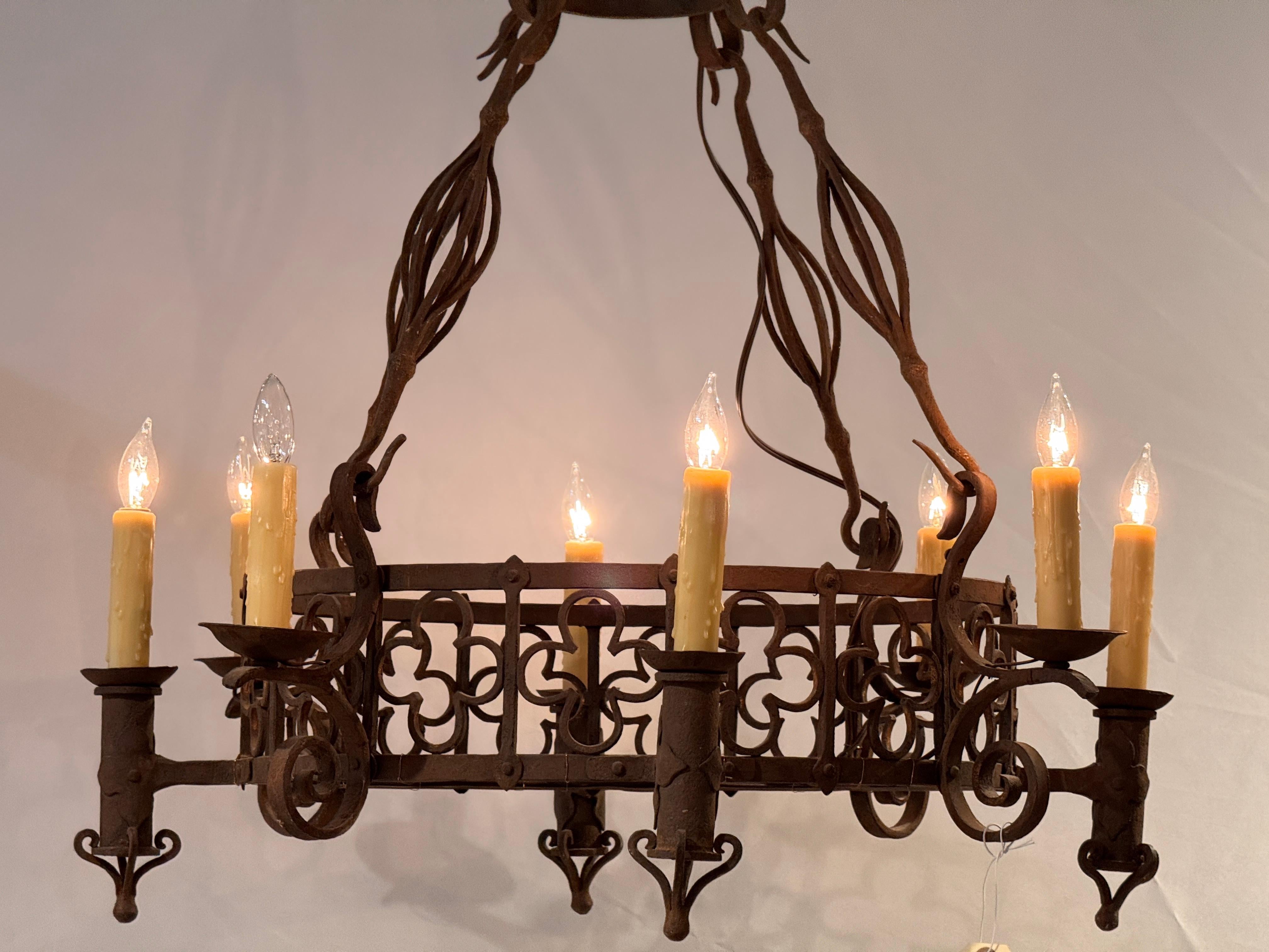Early 20th Century Large Iron Chandelier With Gothic-Inspired Scrollwork For Sale