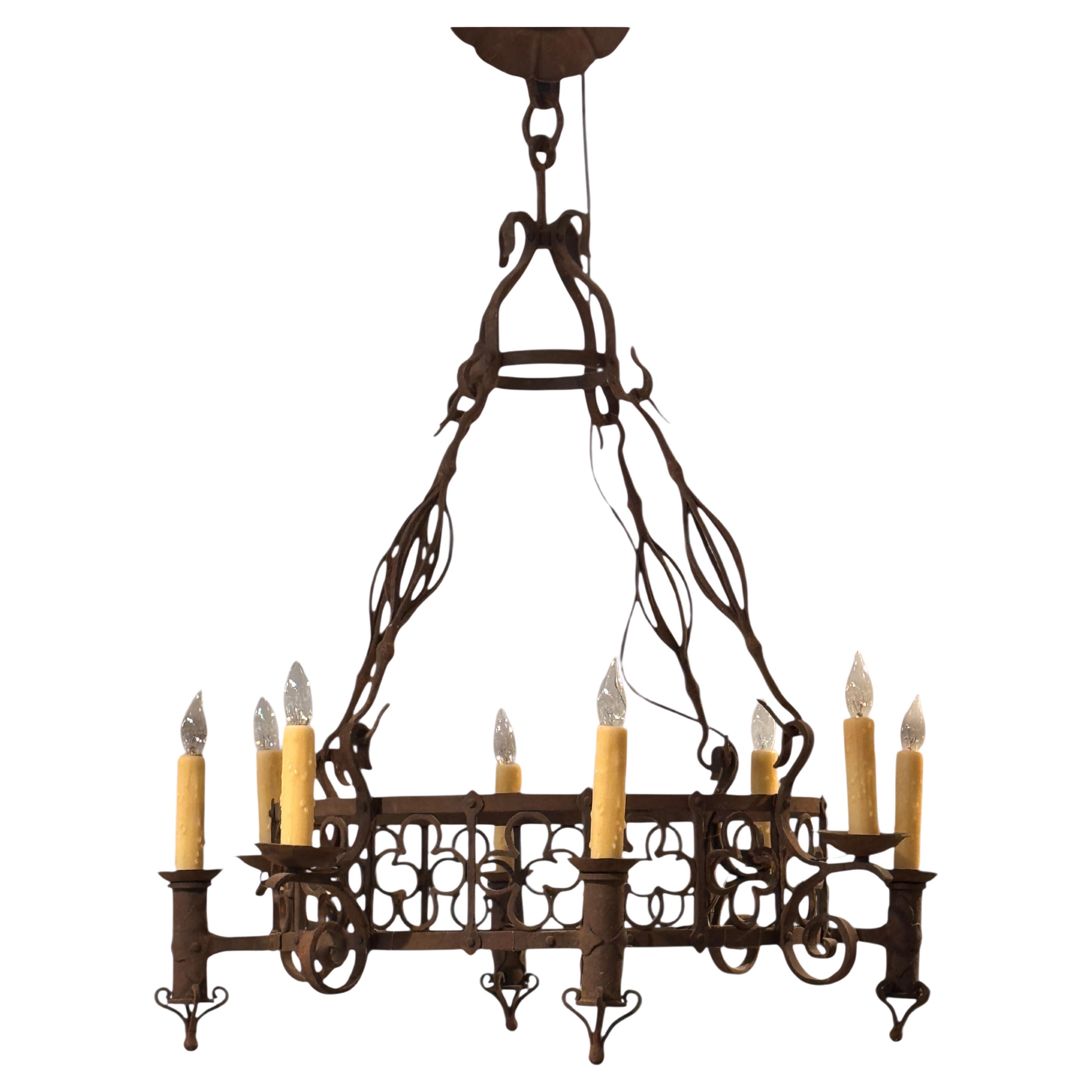 Large Iron Chandelier With Gothic-Inspired Scrollwork For Sale