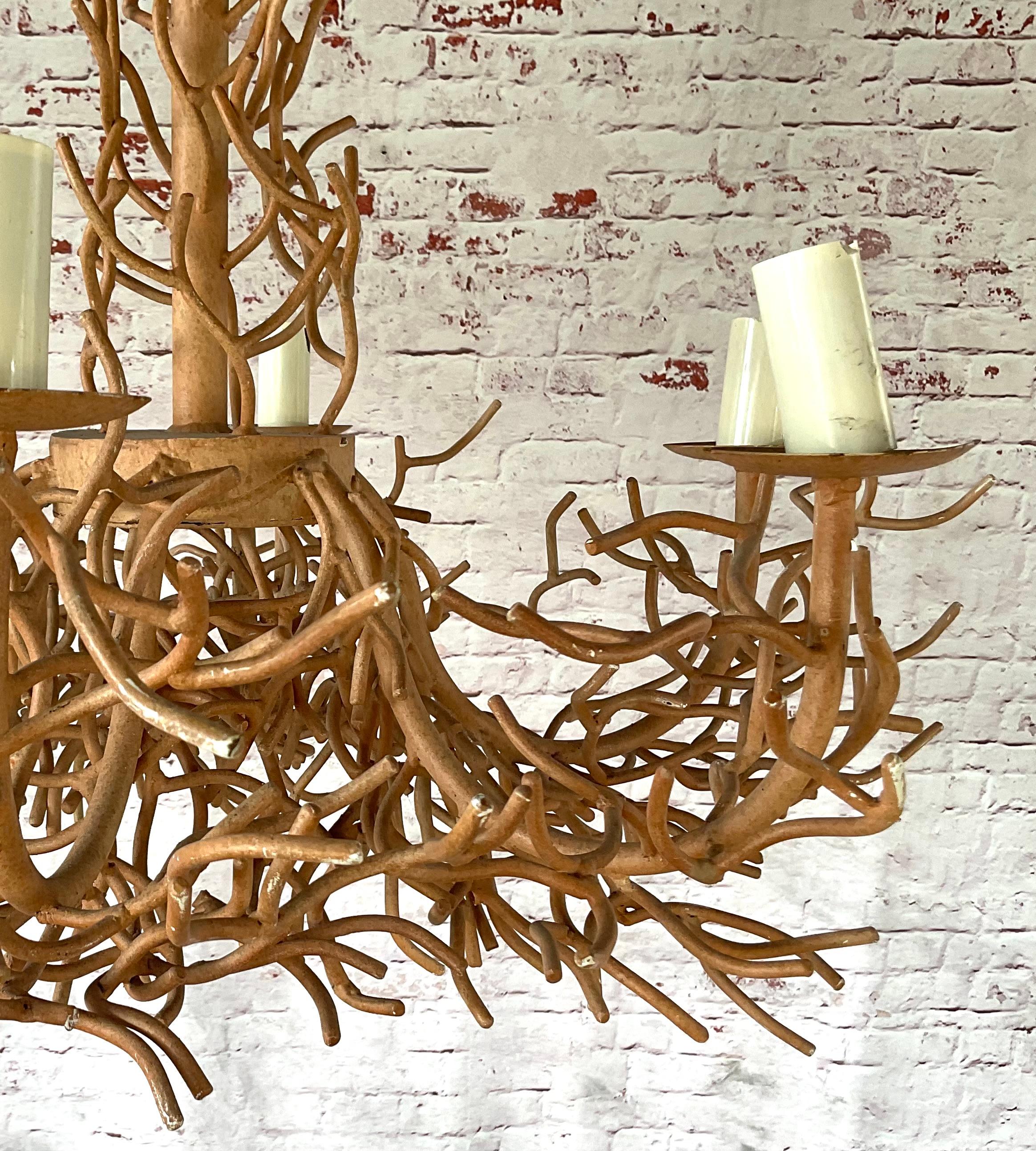Large Mid-20th Century Chandelier made of iron and interspersed with intricate tendrils of faux coral branches, rendered in iron and naturalistic painted finish. Includes six white wax candle sleeves. This piece evokes the organic forms of sea