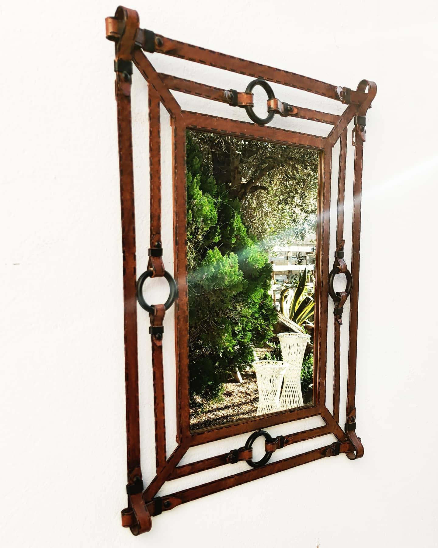 Large Iron mirror like Leather by Jean Pierre Ryckaert, manufactured in France in 1960s. Incredible work of the artist. 
Dimension of Mirror : (cm) 40 W x 60 H.
Dimension all: (cm) 69 W x 88 H x 6 D.