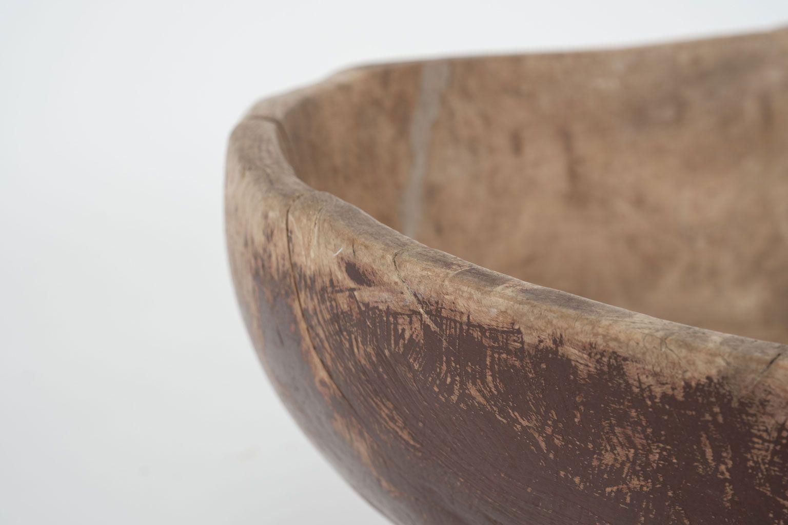 Large irregular-shaped Swedish root wood bowl dating to the mid-19th century. Hand-carved from root wood. Retains remnants of old red paint and marker's mark.

Note: Regional differences in humidity and climate during shipping may cause antique and