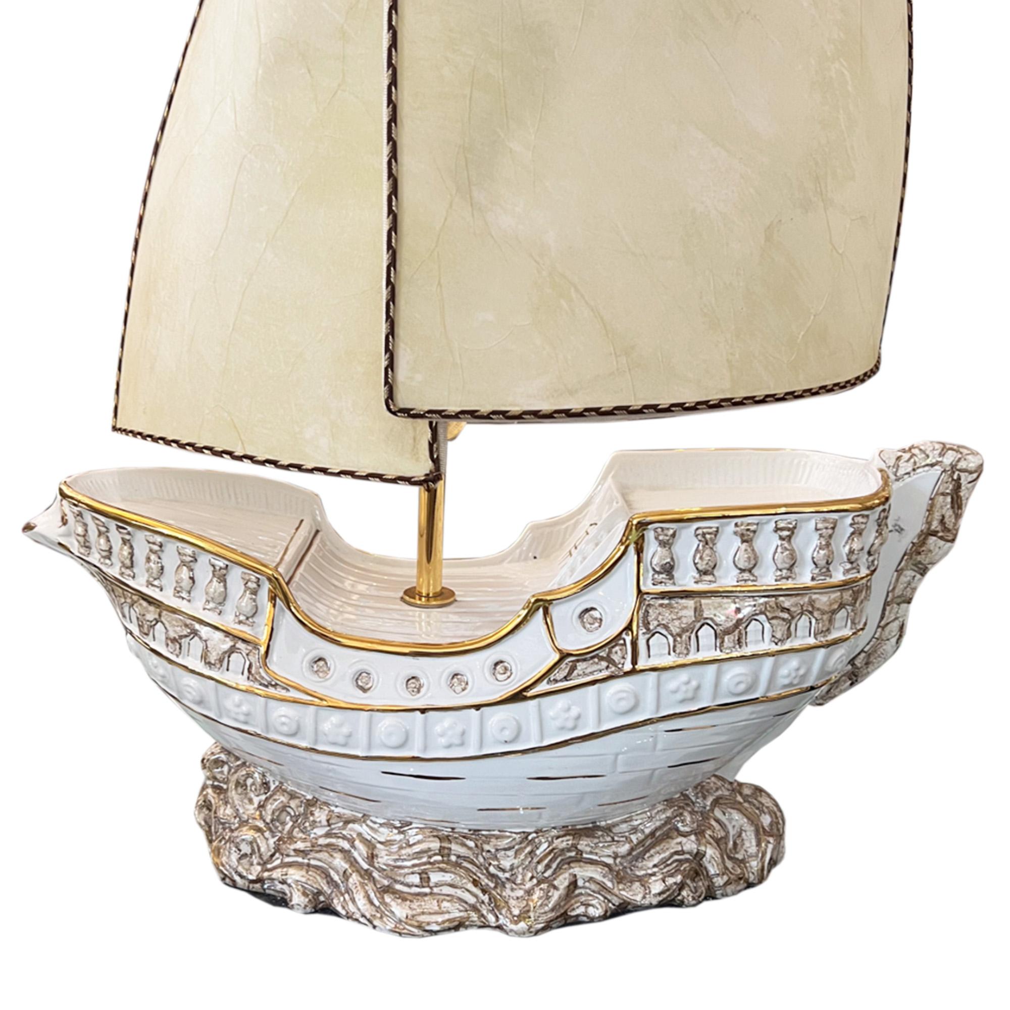 This fantastic ceramic table lamp is made in the shape of a large galleon.

Italian 1970s, with the original parchment sail shades. 

We've had it rewired for the UK with twisted flex. This can be easily changed for any destination - please get in