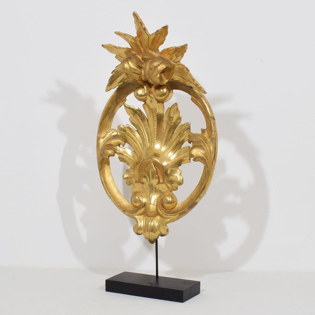 Beautiful and large carved giltwood ornament Italy, circa 1850.
Weathered and old repairs
Measurements include the wooden base.