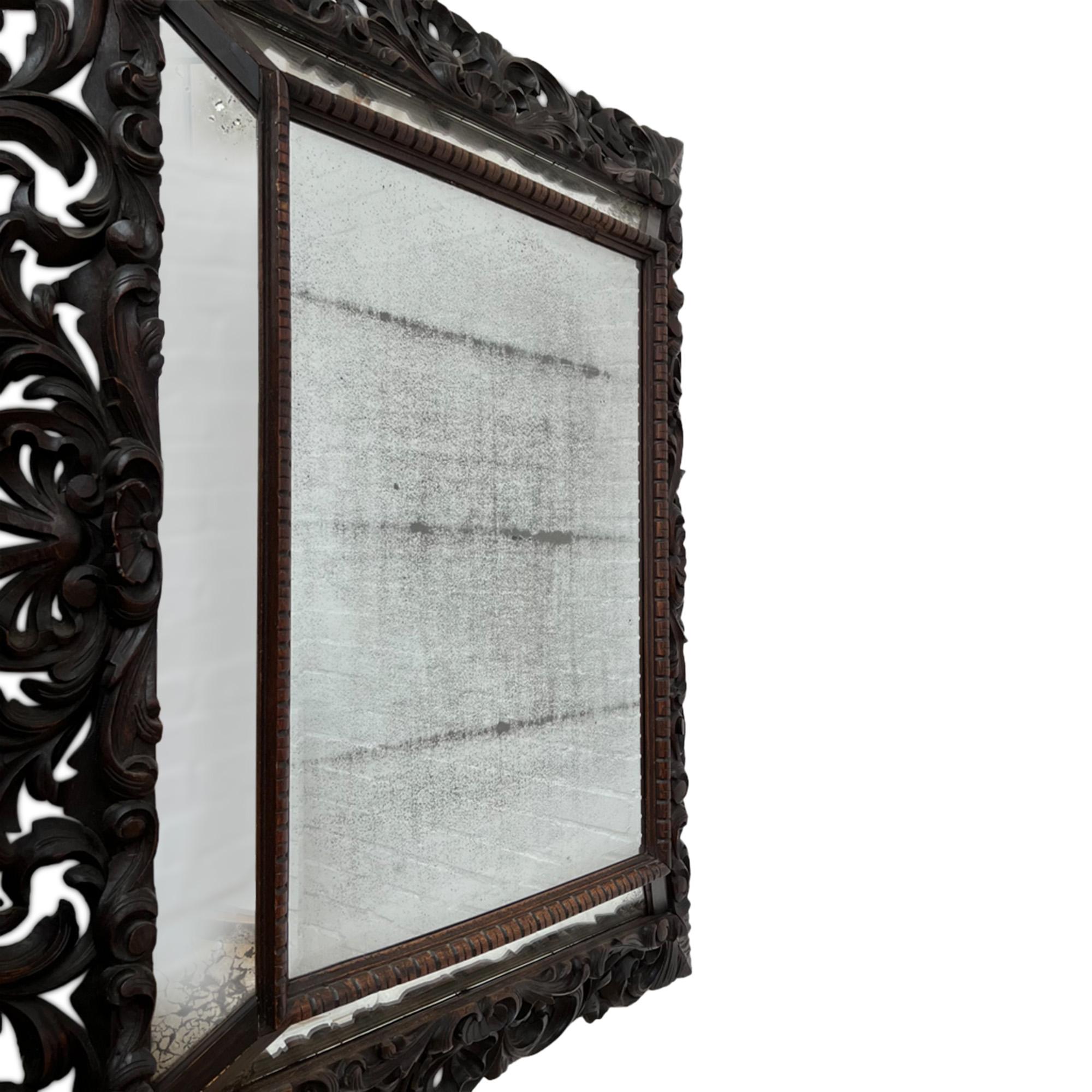 This beautiful mirror was made in Italy in the 19th century.

Large and impressive with lovely detail on the carved wood frame. 

A very decorative piece.