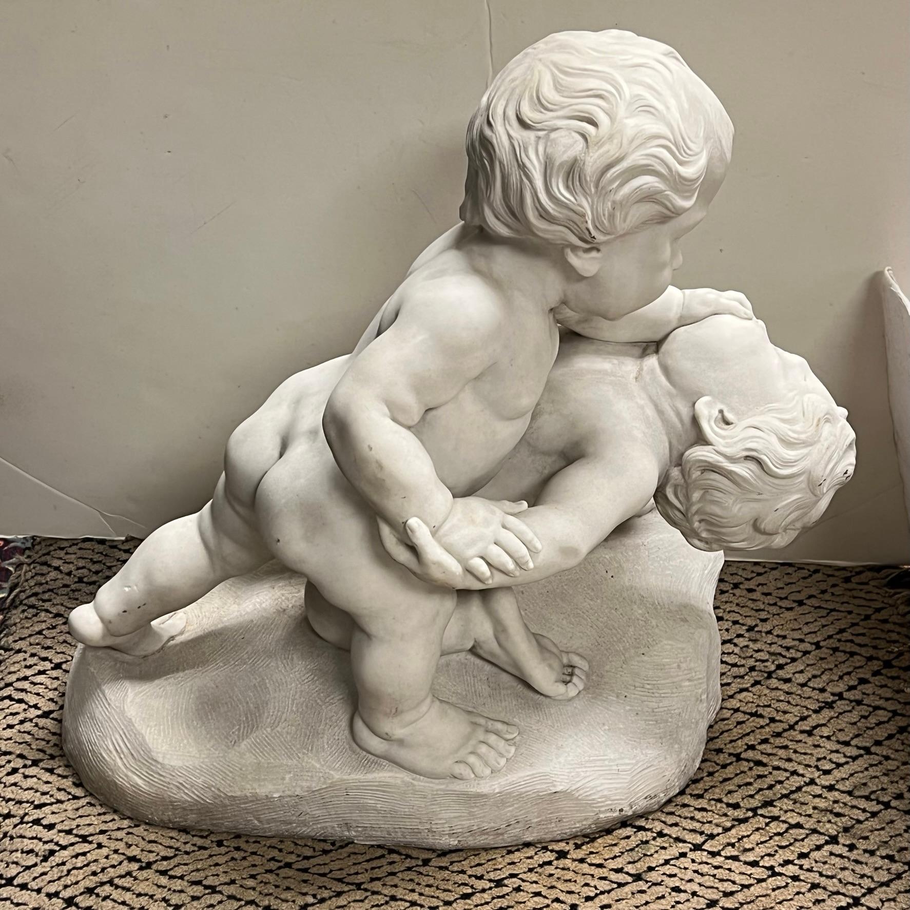 Italian 19th century marble statue of wrestling cherubs. Apparently unsigned.