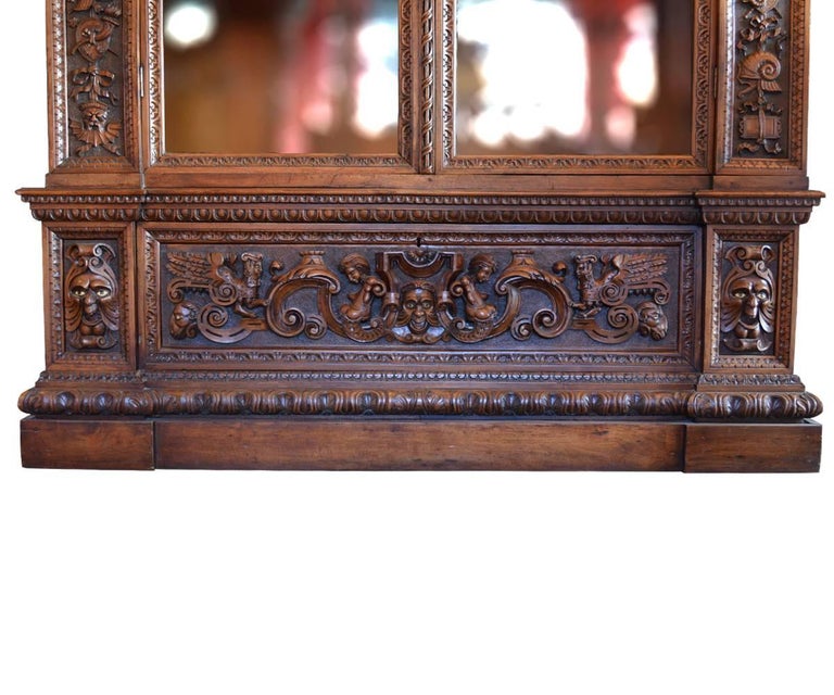 Carved Large Italian Antique Walnut Bookcase with Original Glass For Sale