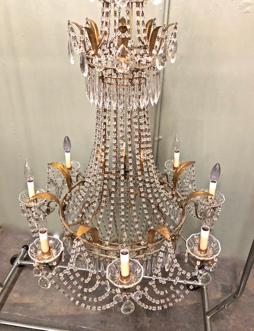 This is superb example of Italian creativity and craftsmanship. The chandelier derives its form from Classic Baltic Chandeliers of the 19th century, but it has been given a 20th century Italian twist with the addition of multi-swags of macaroni