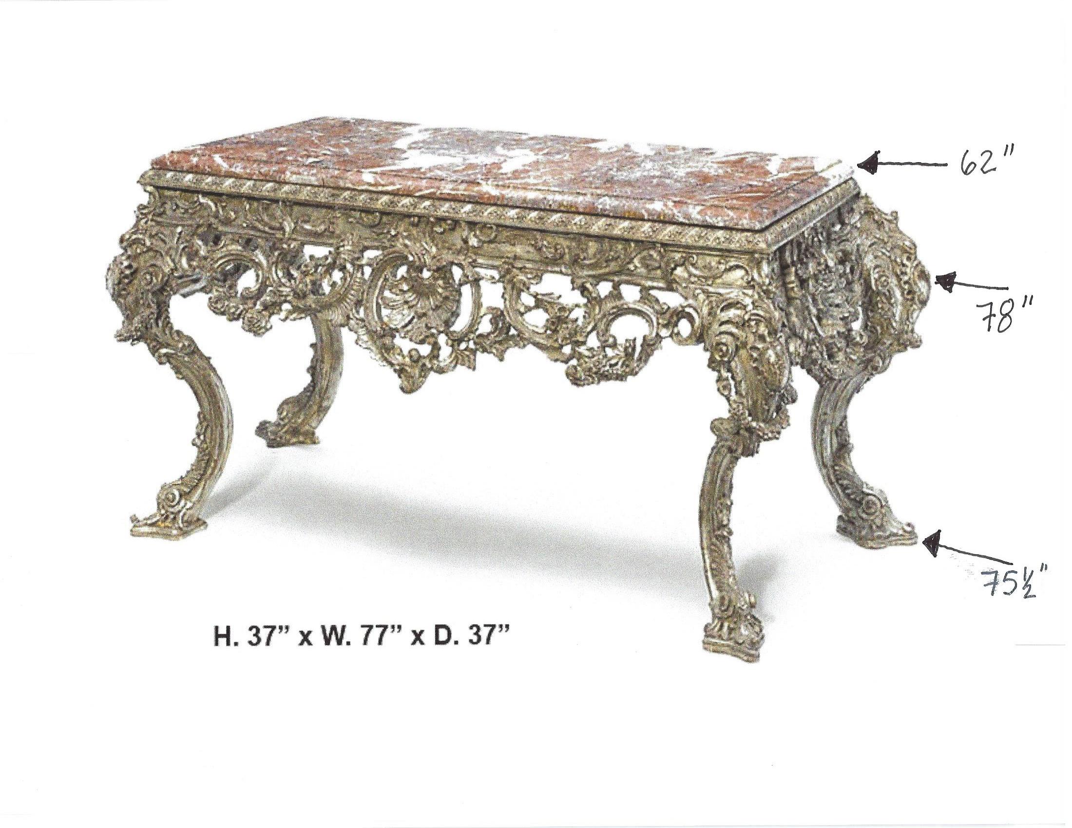 Impressive large Italian baroque style carved silvered wood console, late 20th century.
The thick red marble top over finely carved silver leafed wood frieze with intricate rocaille motif centered by large shell, all on four scrolled cabriole legs.