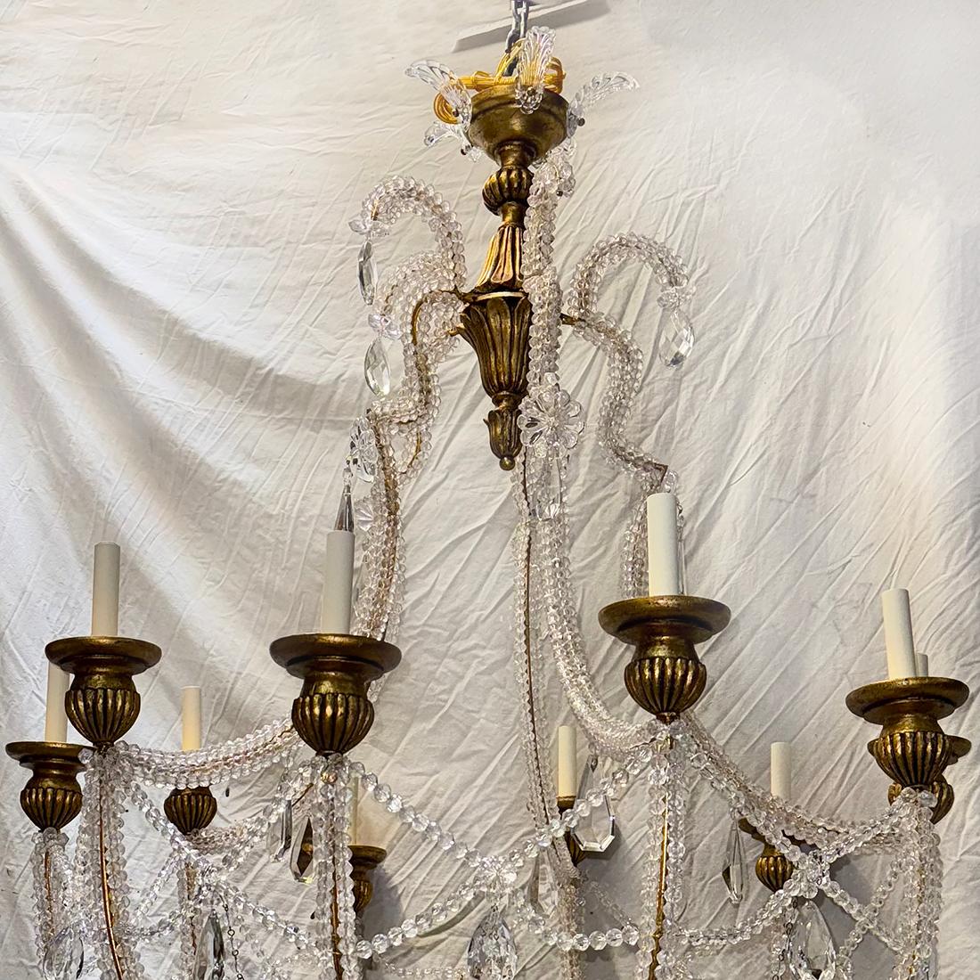 A circa 1940's Italian beaded chandelier with 10 candelabra lights.

Measurements:
Diameter: 42