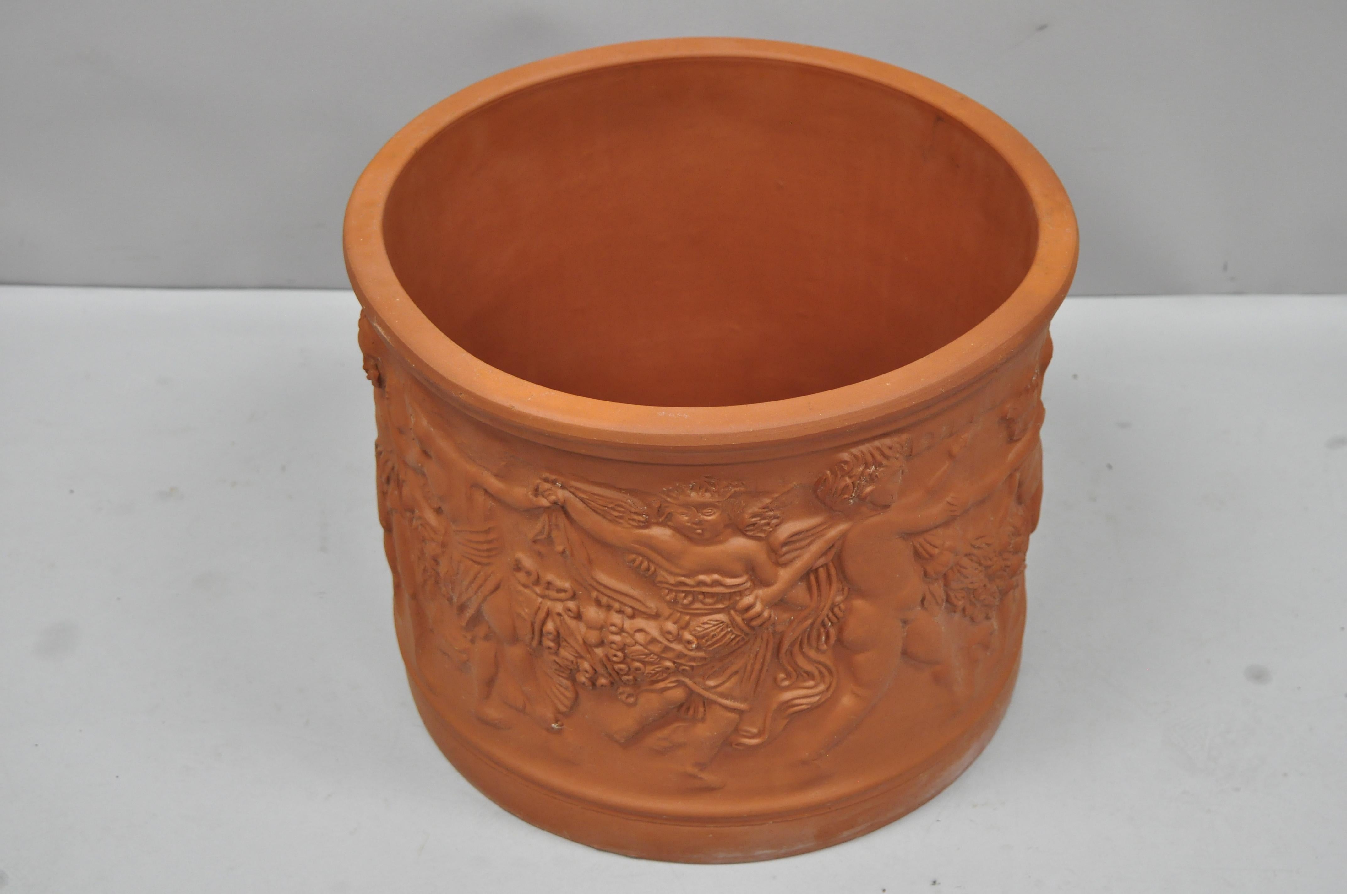 Large Italian Bitossi red terracotta Cherub Putti garden planter flower pot. Item features decorated with frieze of dancing putti carrying fruity festoons, marked with Bitossi manufacturing impression, currently 7 available, circa mid-20th century.