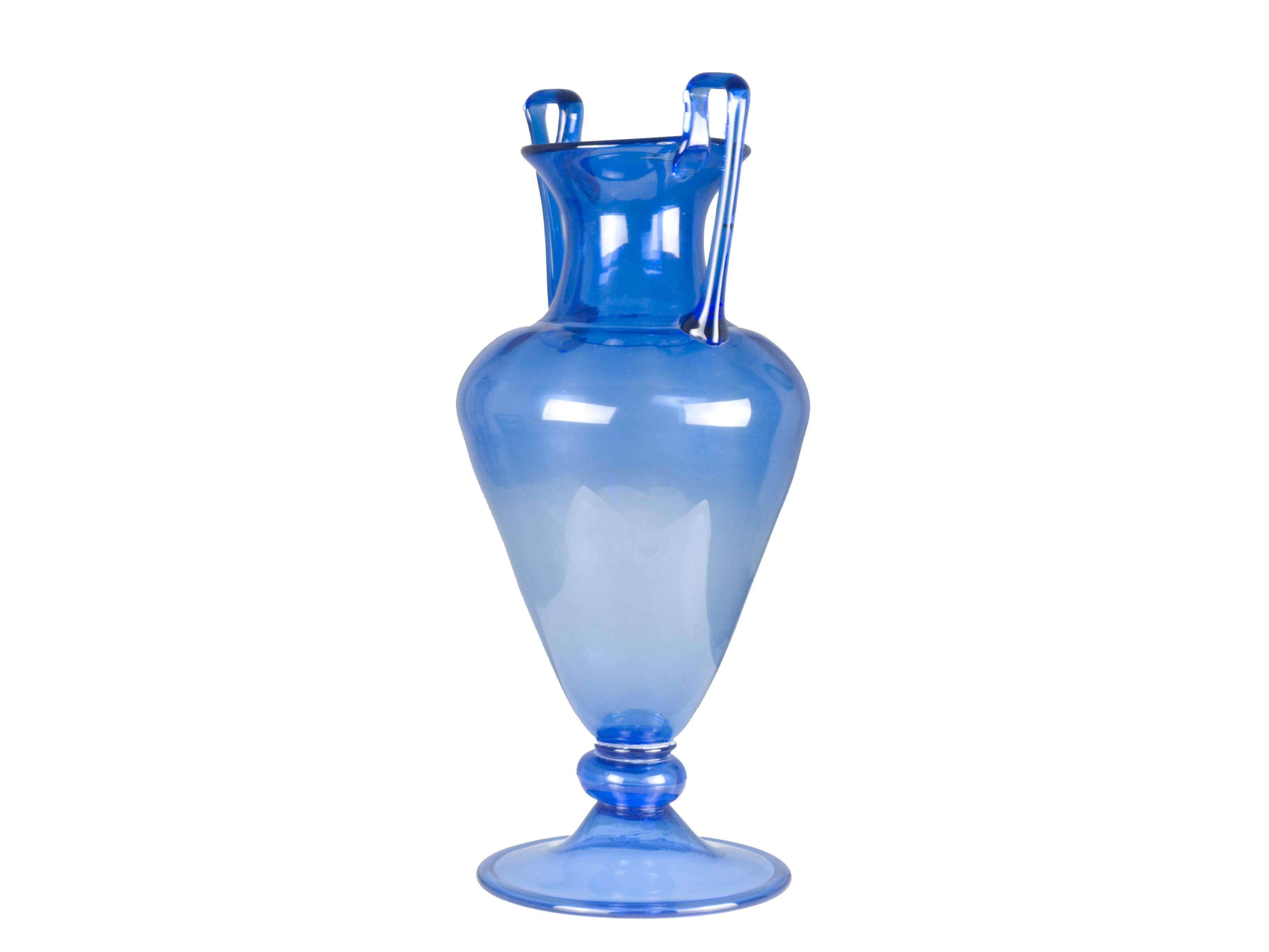 This large vase was produced in Italy between the 1930s and the early 1940s. It is made from an elegant blue Murano glass and remains in good condition: as you can see from the last pictures there is an internal hairlinecrack between one of the