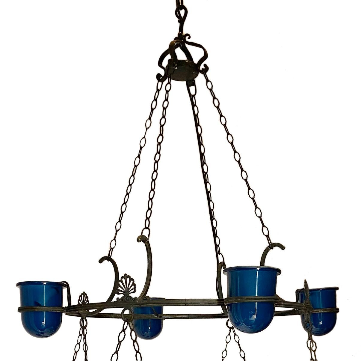 A large circa 1900s sixteen light patinated and cast bronze Venetian chandelier with aqua blue glass insets.

Measurements:
Height: 53? (Adjustable)
Diameter: 42.5?