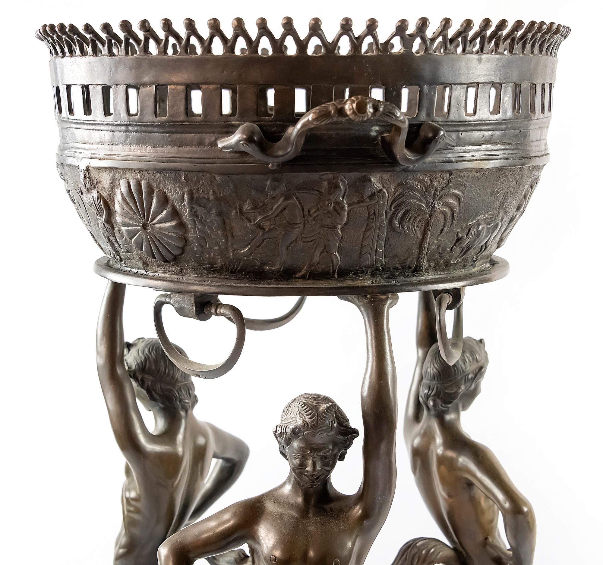 Classical bronze jardinière / planter with handles on legs by three male figures of Satyr. Bronze is patinated. Pot is decorated with antique scenes. Its is heavy and stable.