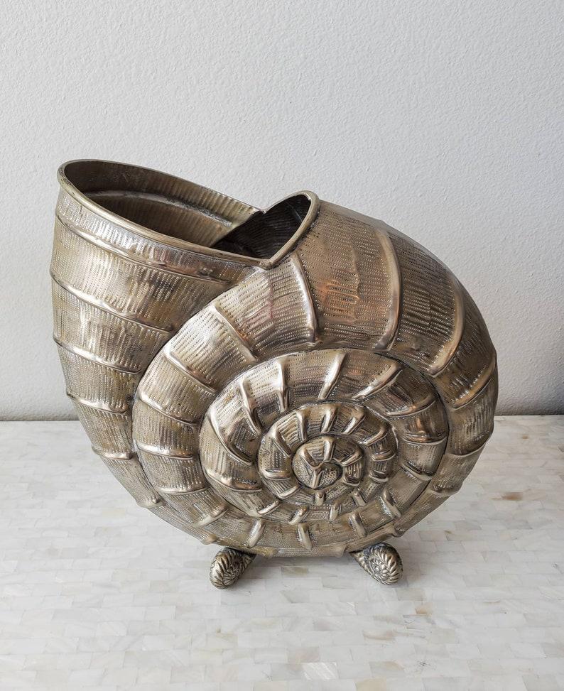 A large high quality Italian Mario Buccellati style decorative silver plate nautilus shell vase, richly detailed, rising on four heavy solid spiraled shell form feet. Elegantly aged, warm, patina over the whole.

Good proportions and mix of