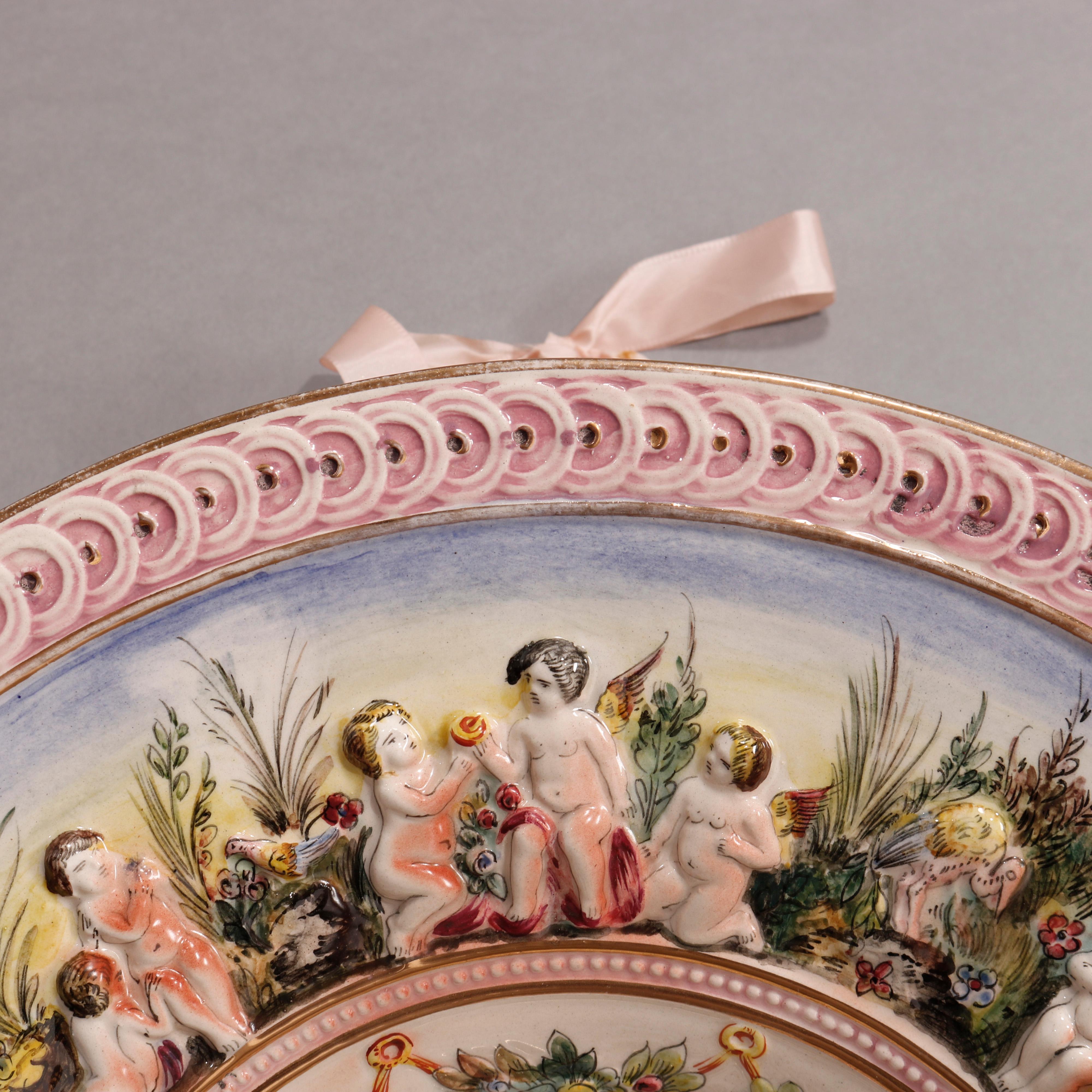 Large Italian Capodimonte Porcelain Center Bowl, Cherubs Scene in Relief, 20th C In Good Condition For Sale In Big Flats, NY